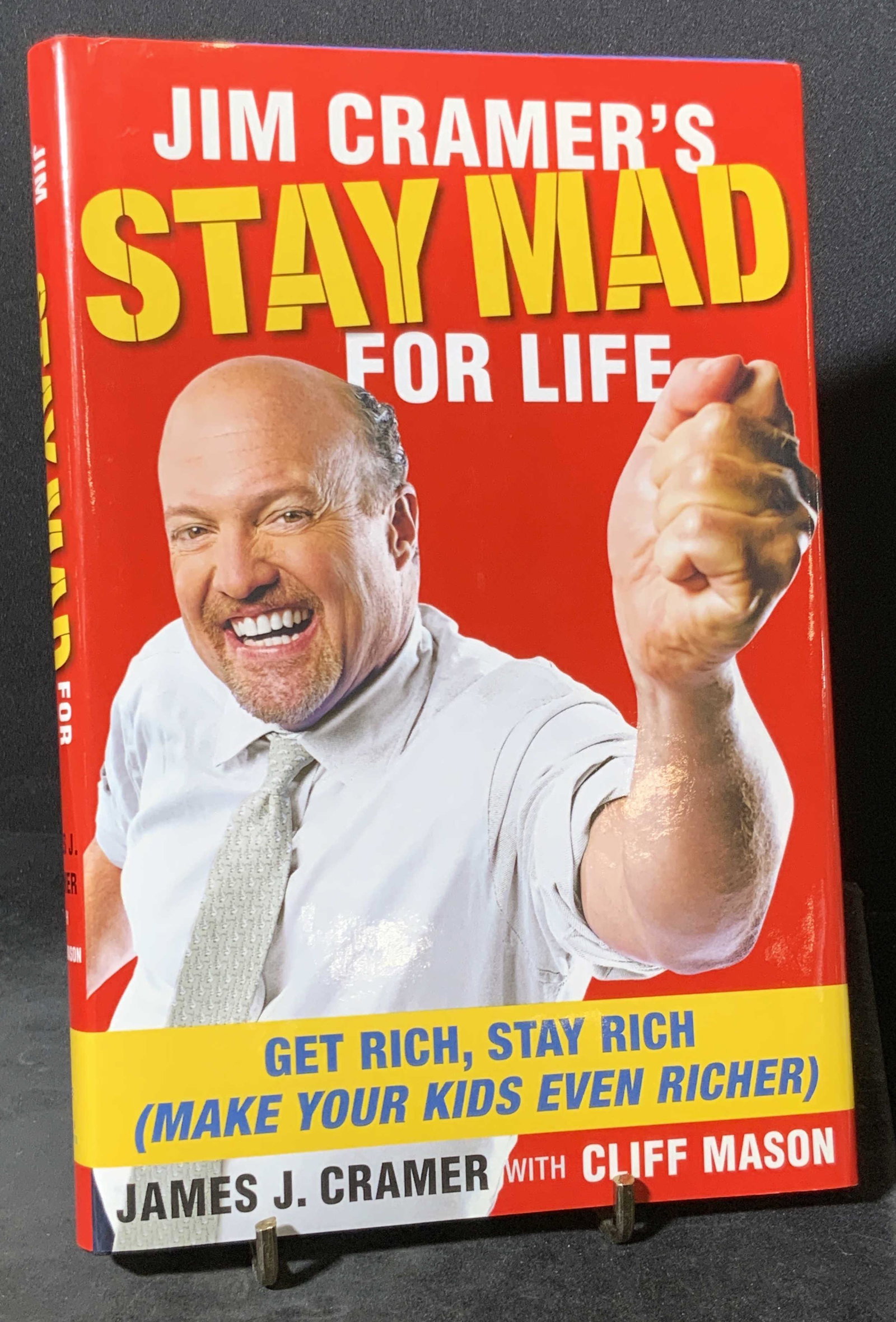 Signed JIM CRAMER to REGIS PHILBIN, Book: A hardcover book titled JIM CRAMER’S STAY MAD FOR LIFE. Written by James J. Kramer & Cliff Mason. Interior is signed by Jim Cramer. Signature reads: ‘Regis, you are my idol, Jim Cramer’. Publish