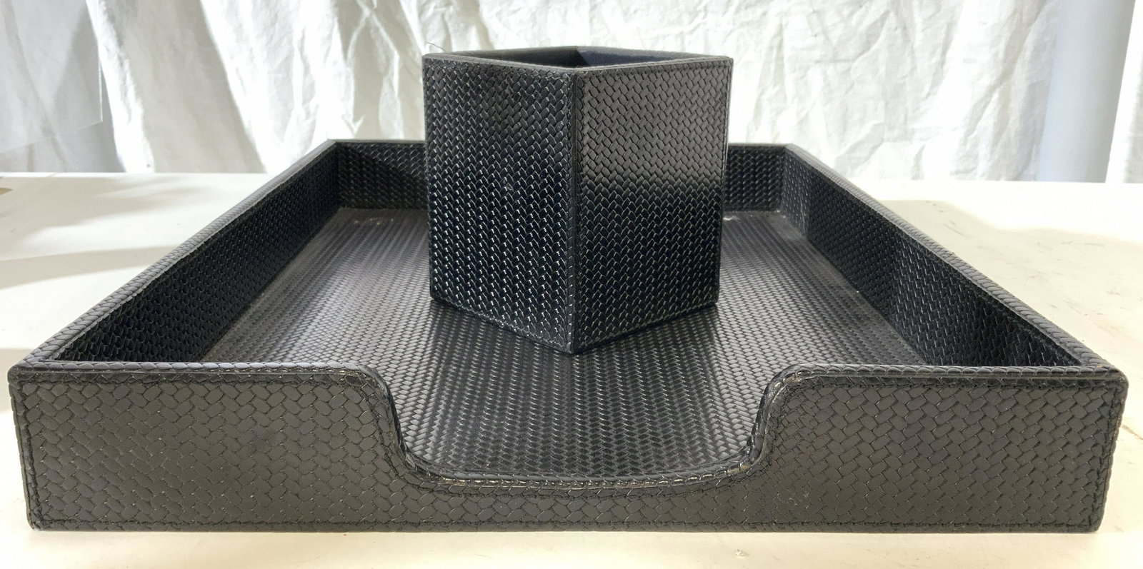 Lot 2 Leather Document Holder & Pen Holder: Lot includes document holder and pen holder. Each are black toned & appear to possibly be genuine leather. Each piece has woven appearance. Document holder measures approx 15.5 inches long 12.5 inches