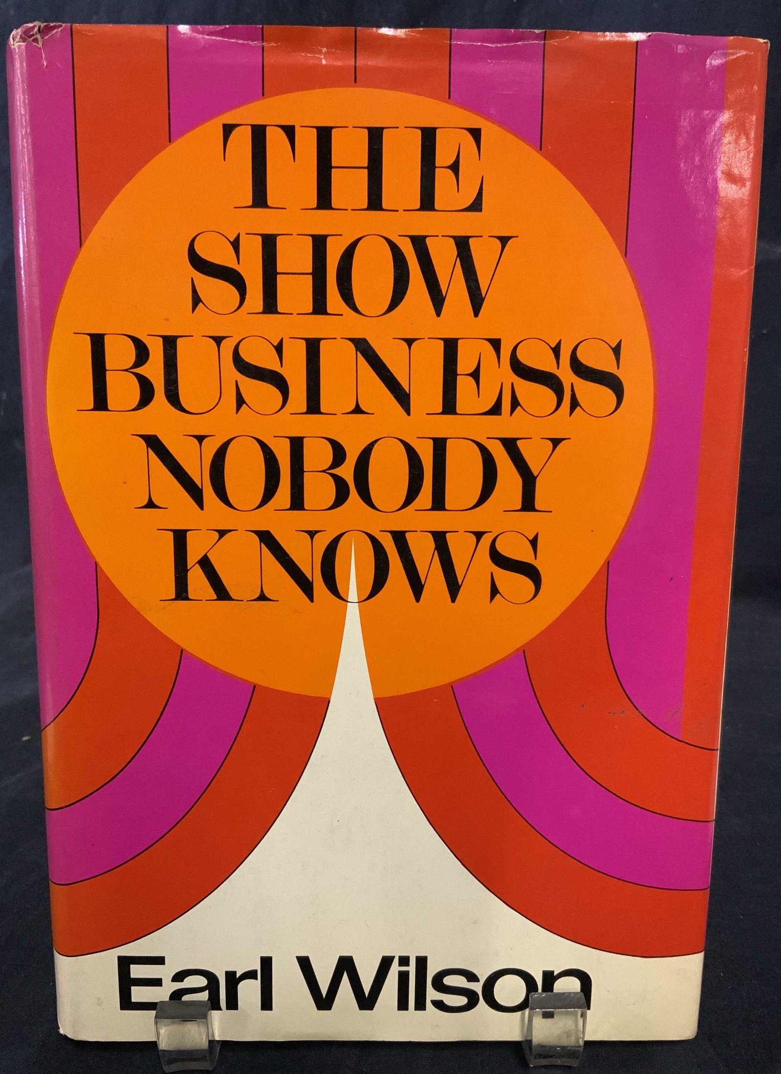 Signed EARL WILSON to REGIS PHILBIN: A hardcover book titled THE SHOW BUSINESS NOBODY KNOWS ABOUT Written by EARL WILSON. Interior is signed. Signature reads: Â‘DEAR REGIS THANKS FOR YOUR FRIENDSHIP, EARL WILSONÂ’ Published by Cowl