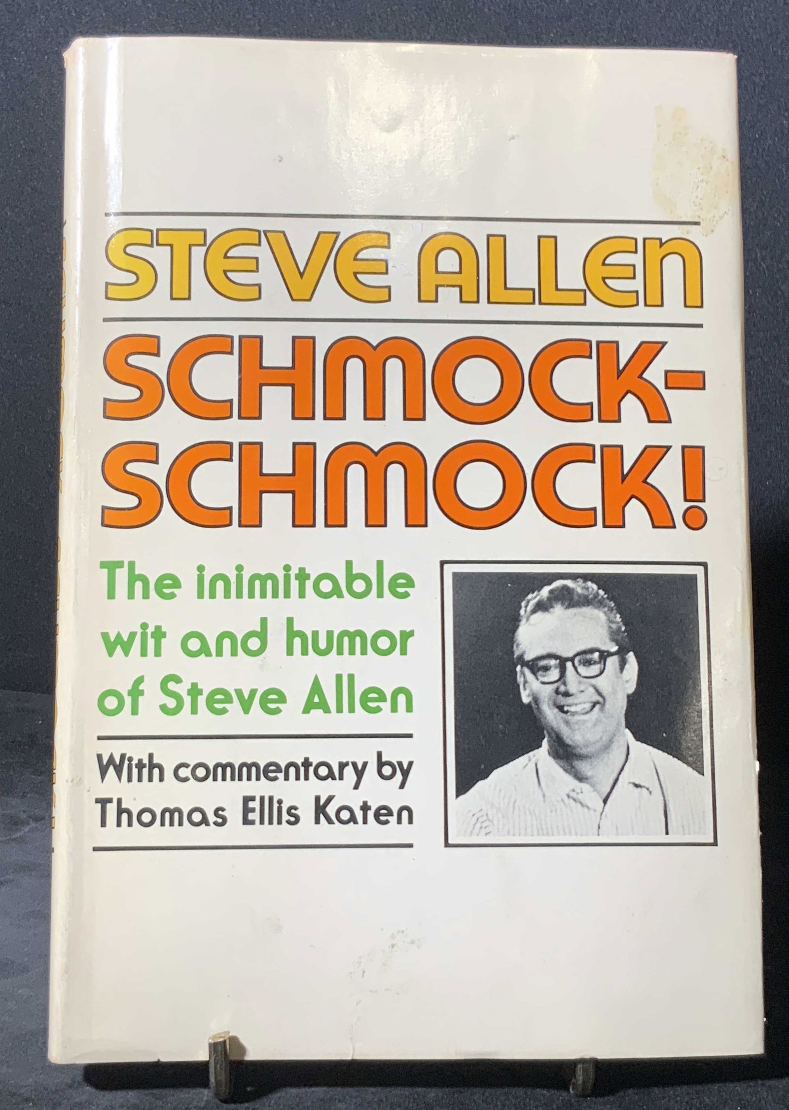 Vntg Book Signed STEVE ALLEN to REGIS PHILBIN: A hardcover book titled STEVE ALLEN SCHMOCK SCHMOCK. Written by Steve Allen, commentary by Thomas Katen. Interior is signed by Steve Allen. Signature reads: ‘Regis, thank a million, all good wishes,