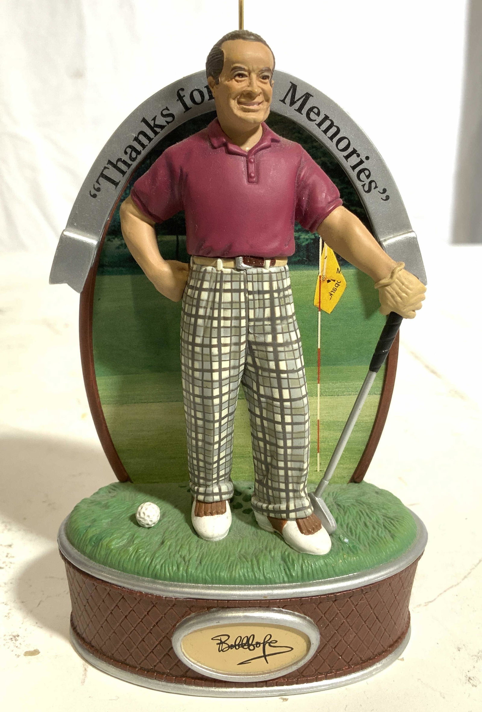 Bob Hope Golf Figure Ornament: Front of base is marked BOB HOPE top of piece reads “Thanks for the memories”. Backside has commemorative paragraph about Bob Hope. Backside has small button. Top of base appears to have small spe