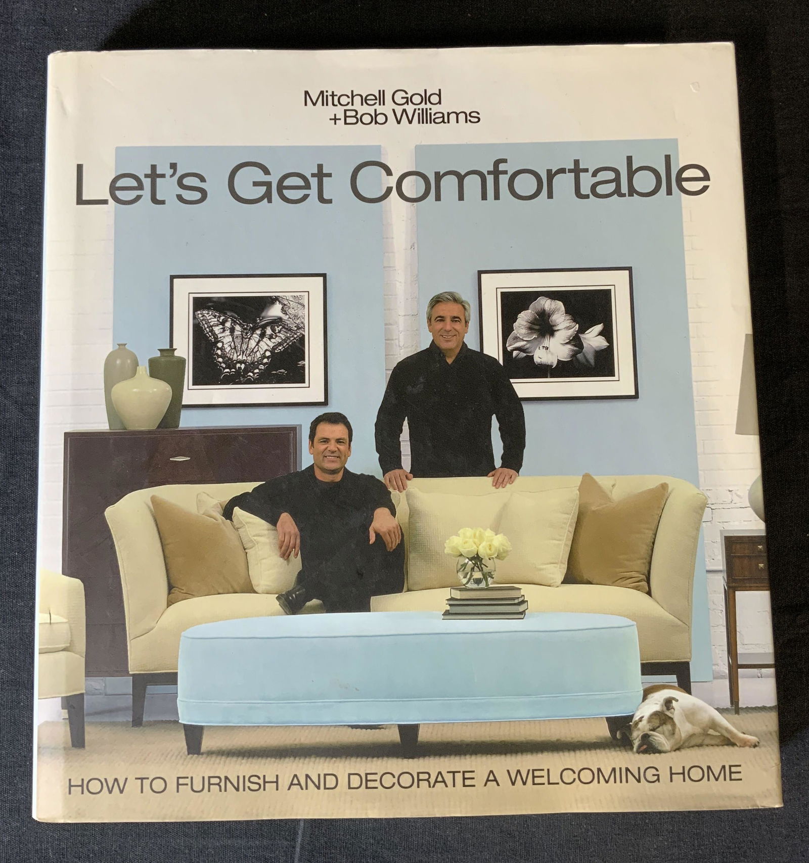 Mitchell Gold & Bob Williams Coffee Table Book: Set of 8 ceramic plates, each is decorated with illustrations depicting butterflies, flowers, and stems arranged in a grid like pattern. Measures approx 12 inches in diameter. Underside trademark read