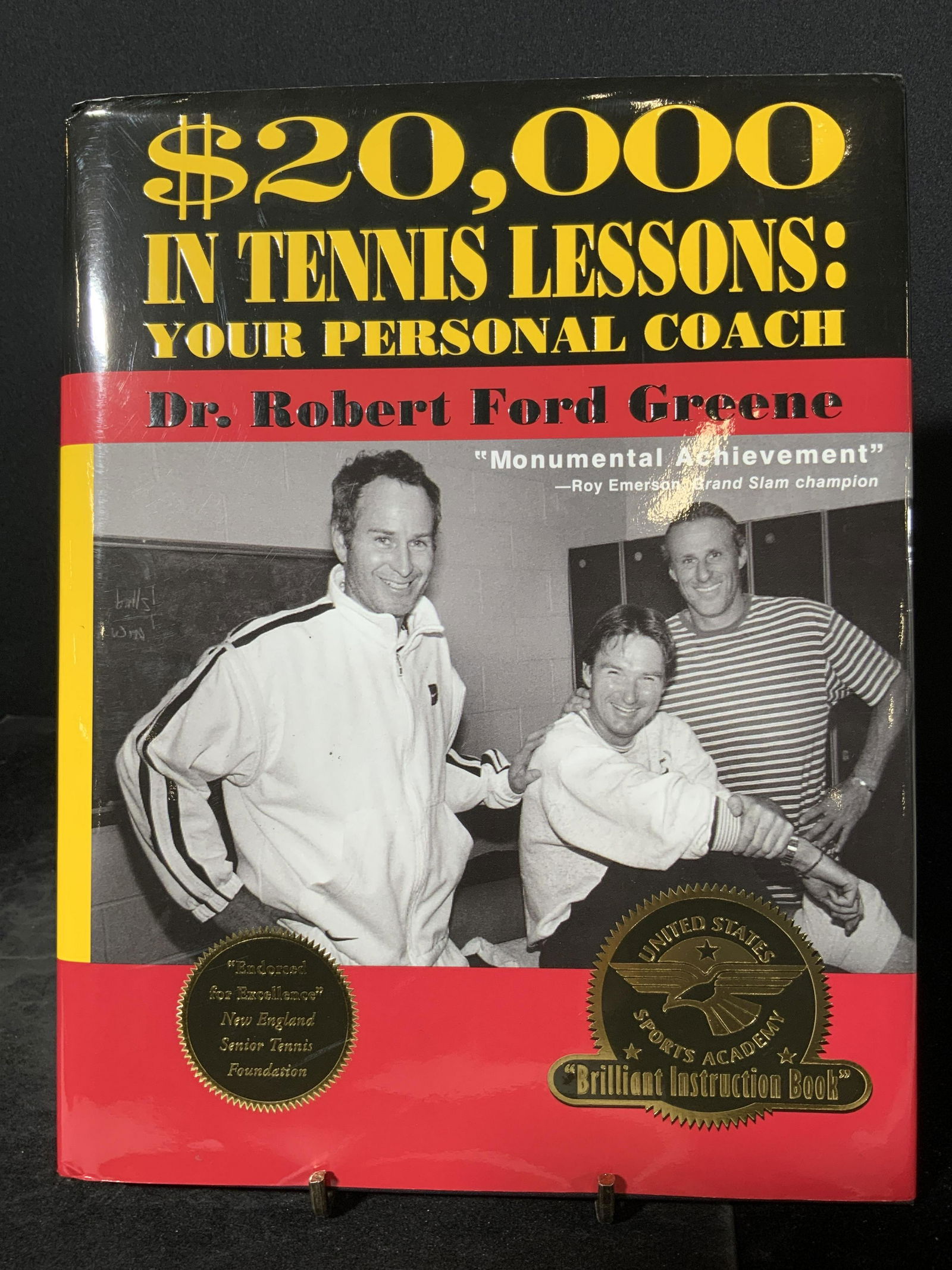 Signed ROBERT FORD GREEN to REGIS PHILBIN Book: A hardcover book titled $20,000 IN TENNIS LESSONS: YOUR PERSONAL COACH. Written and signed by DR. ROBERT FORD GREENE. Signature reads: ‘Regis, If you and Joy would like to hit a few tennis balls som