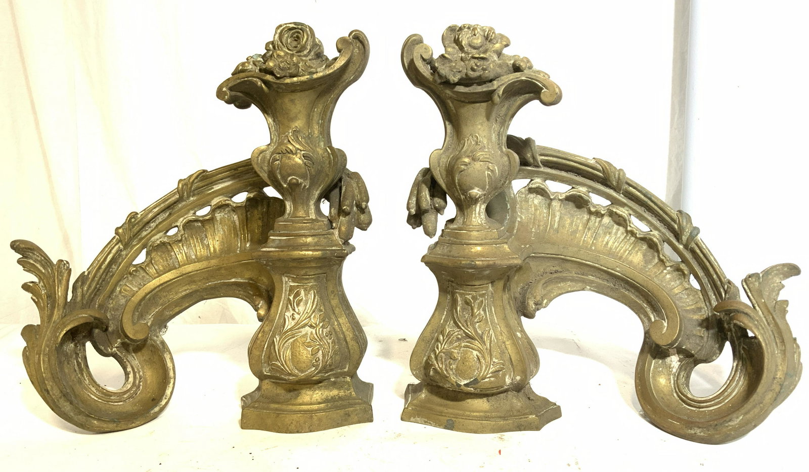 Pair Antique Gilded Bronze Andirons: Lot includes 2 andirons. Each are antique and gilded bronze. Each piece has intricate ornate detail including floral, leaf c & s scroll detail. Each piece measures approx 12 inches tall and wide 4.5 i