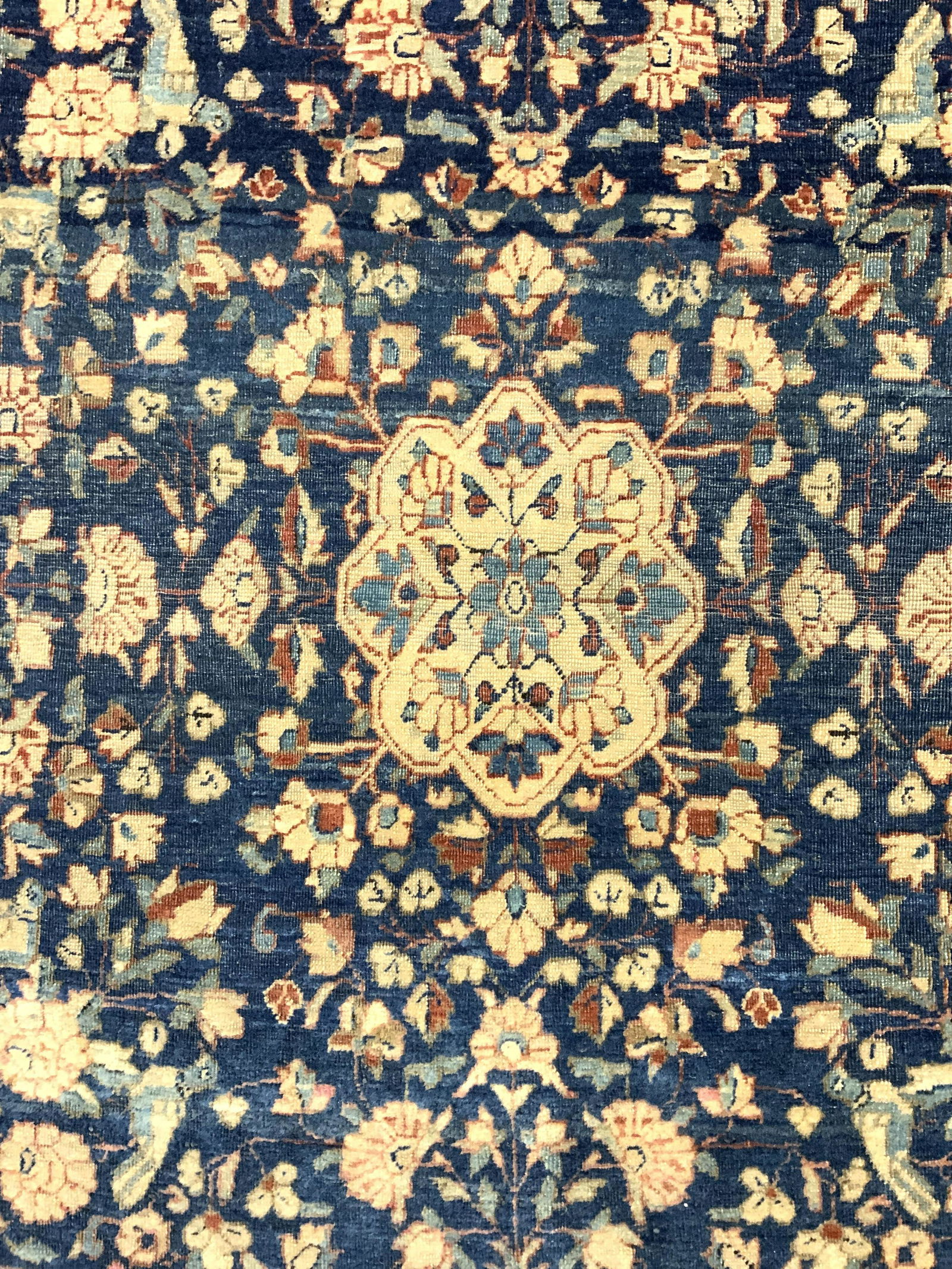 Antique Handmade Persian Wool Rug: Rug is handmade and wool. Piece is antique. Rug appears to be Persian. Piece has intricate multi toned floral vine no leaf detail. Piece has very small fringes. Piece measures approx 36 inches long 34