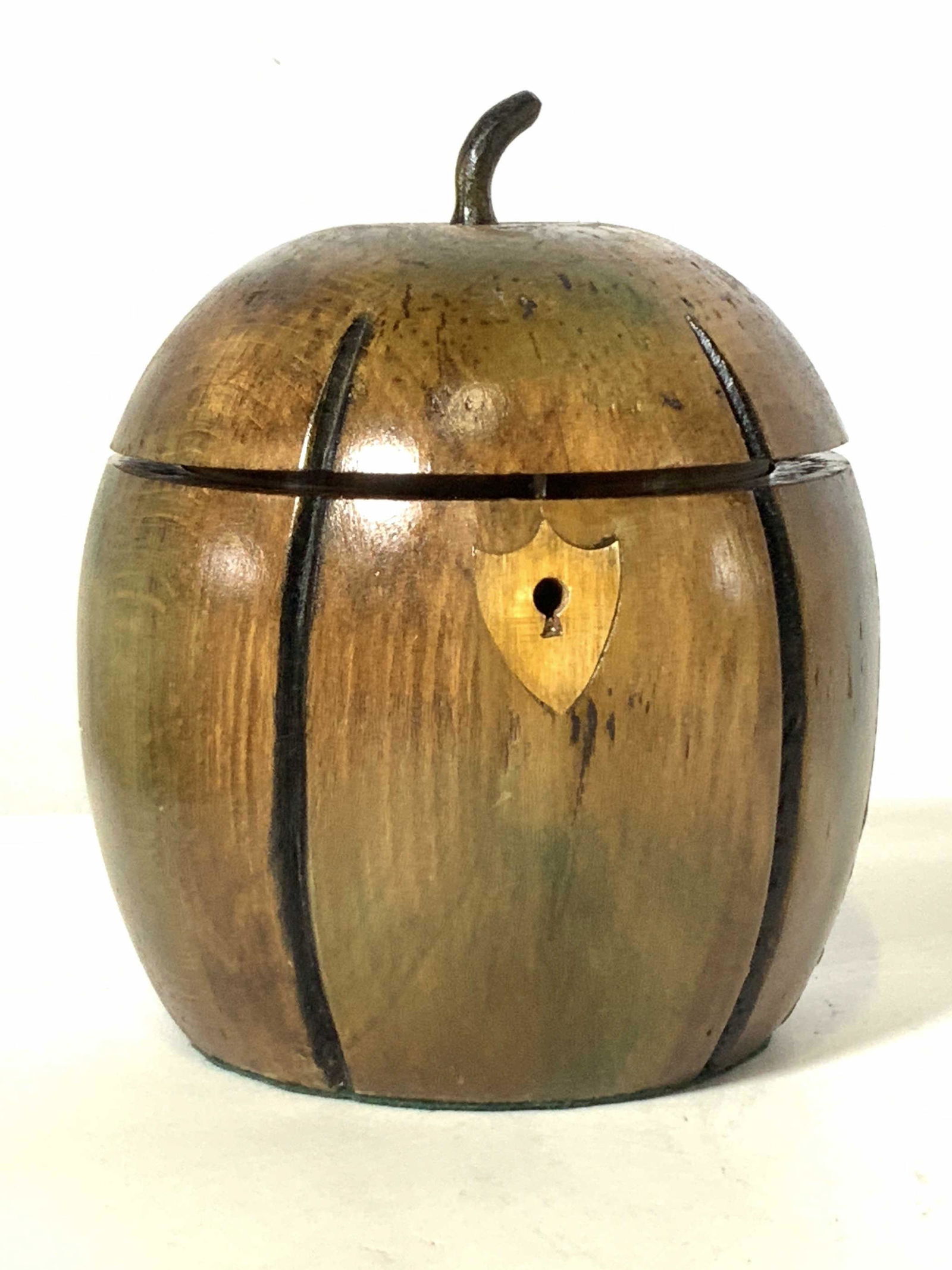 THE FEDERALIST Antique Apple Form Tea Caddy, Eng: Antique, possibly vintage, wooden apple form tea caddy. Once used for storing tea bags, could also be used for storing trinkets. Lid has an apple stem atop it. Hinged lid with metal hardware and key l