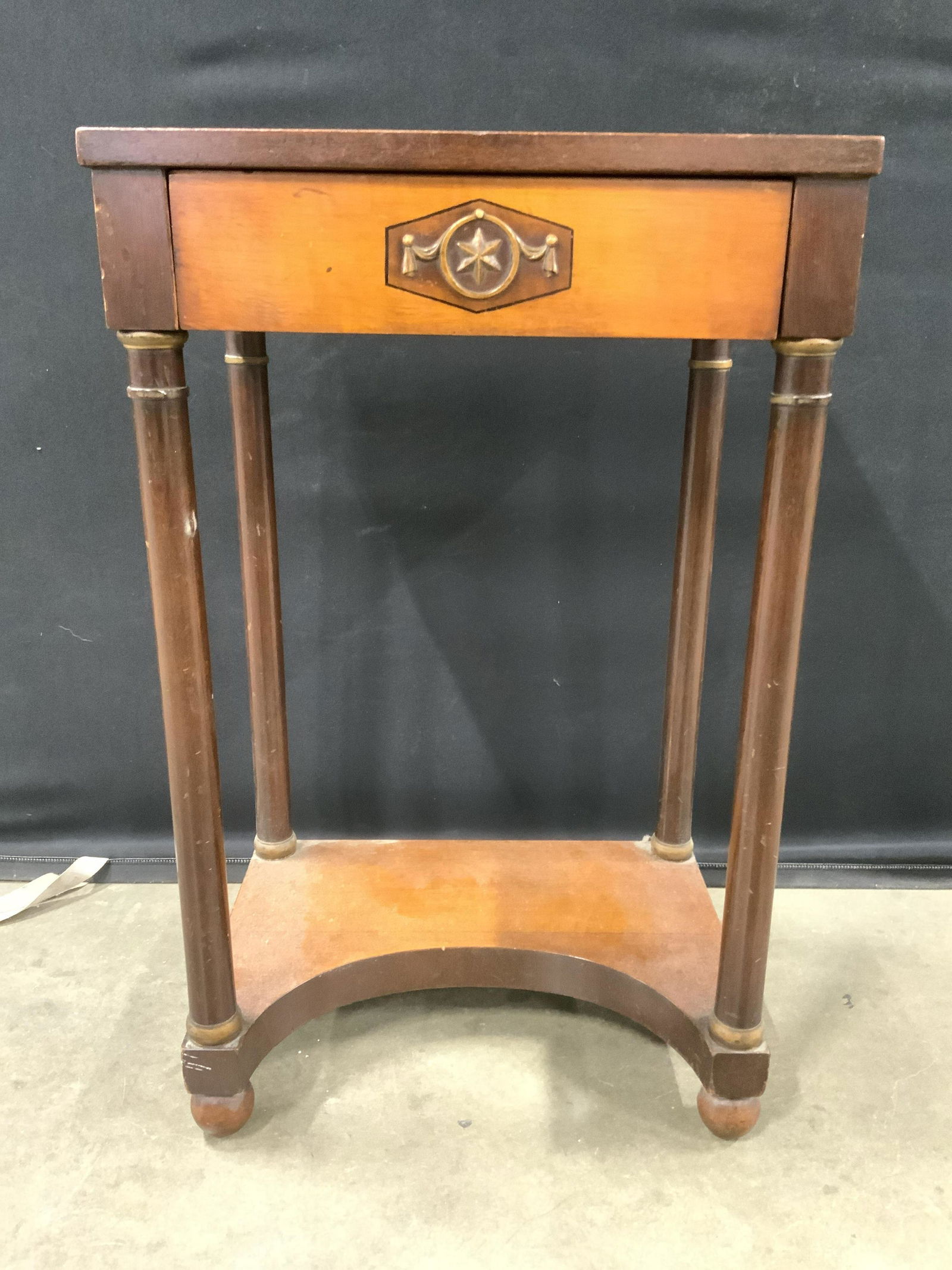 Vintage Carved Wooden Footed Side Table: Side Table is vintage possibly antique. Piece has 1 drawer with carved Star detail of front and hand dovetailing. Legs have board stretcher in between with spherical shaped feet. Piece measures 29 inc