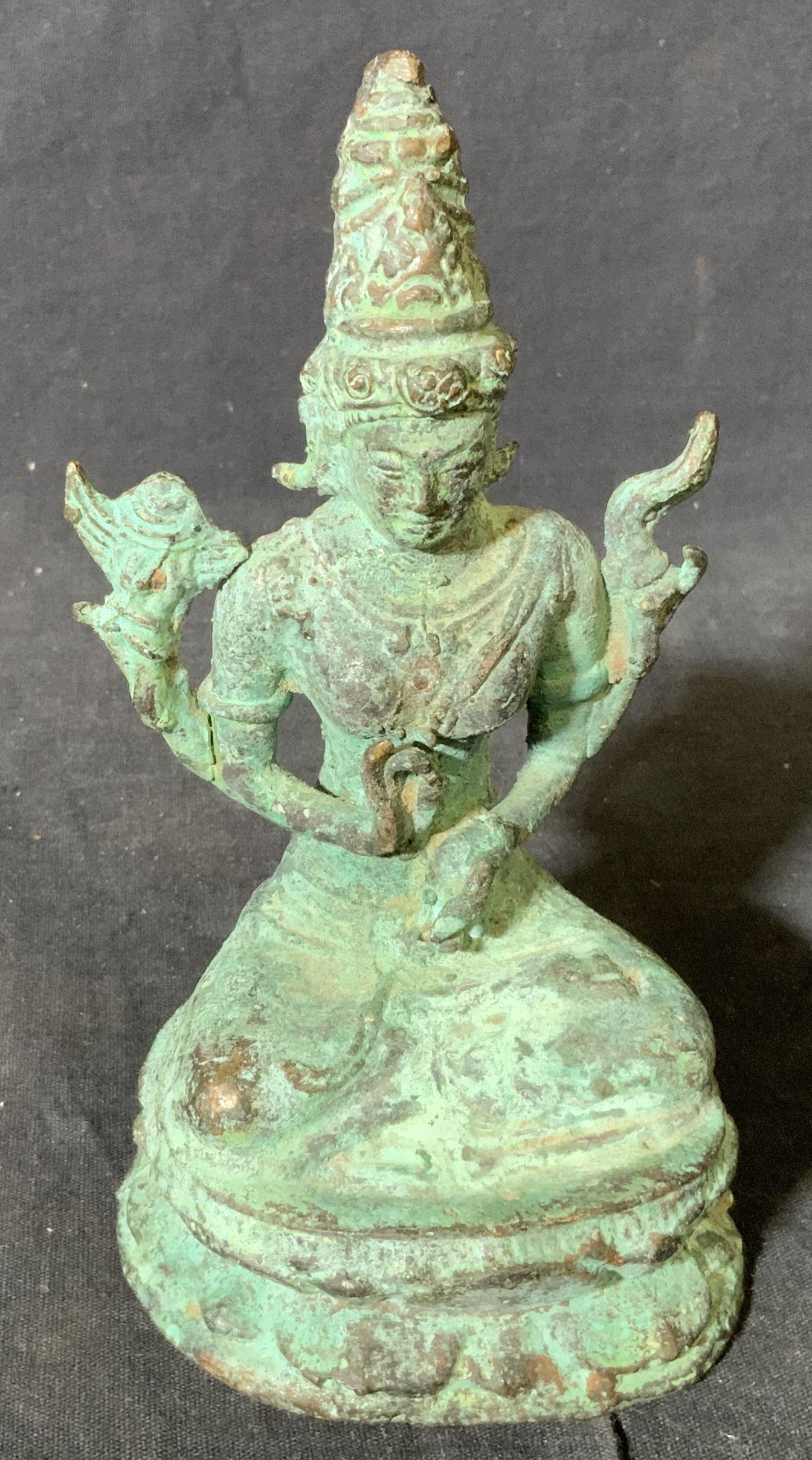 Brass Hindu Goddess Sculpture: Brass Hindu Goddess Sculpture, no apparent inscriptions or markings, goddess sits on a lotus platform with hands in two guan mudras, piece measures 6 inches at tallest point, much oxidation to piece, 