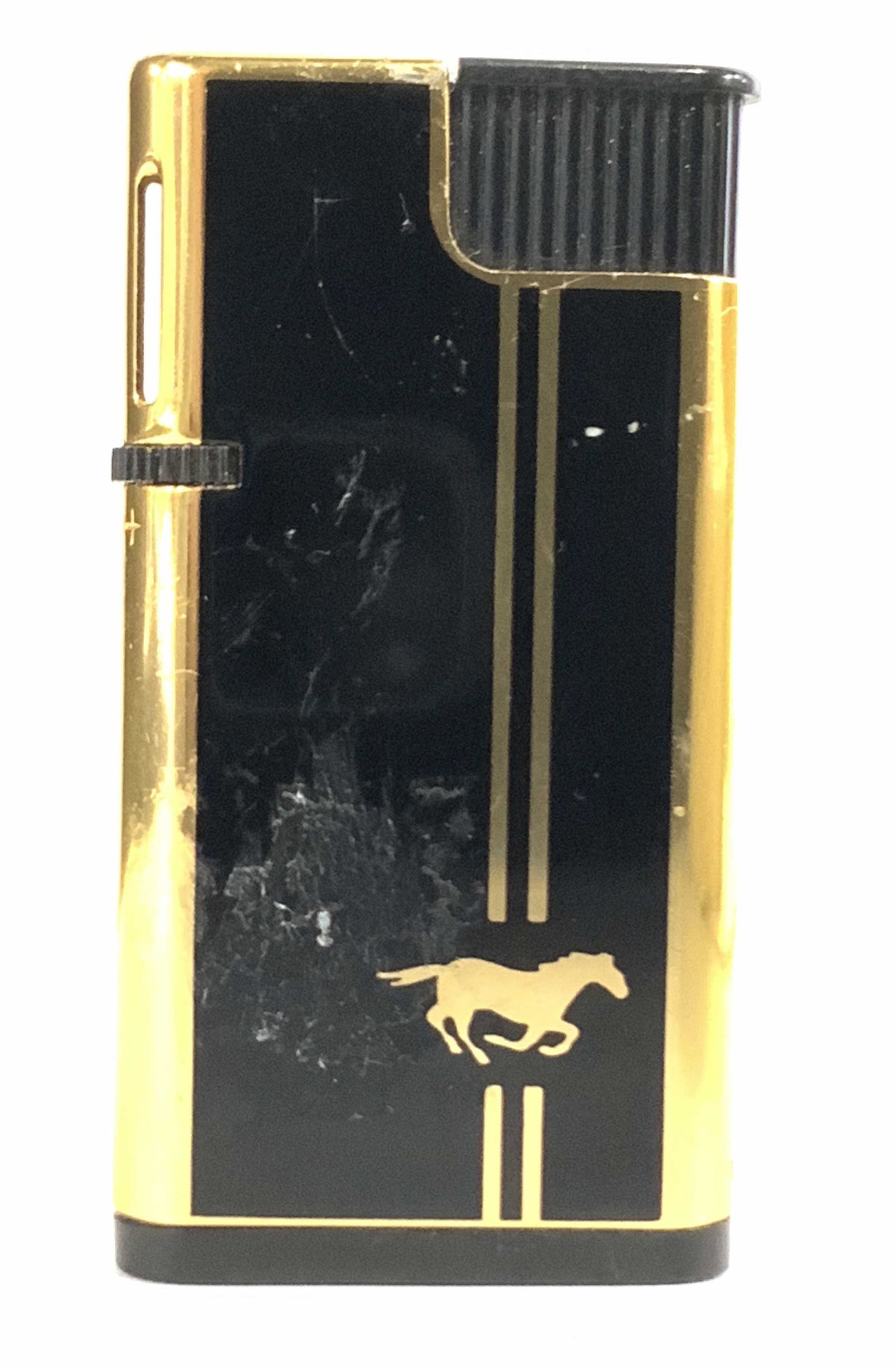 Vintage PENGUIN PIEZO Horse Motif Lighter: A vintage gold tone metal and black composite material lighter. Gold tone metal is polished. A gold tone horse accent decorates the reverse. Underside is signed: PENGUIN PIEZO, A3, JAPAN. Approx. 2.5 