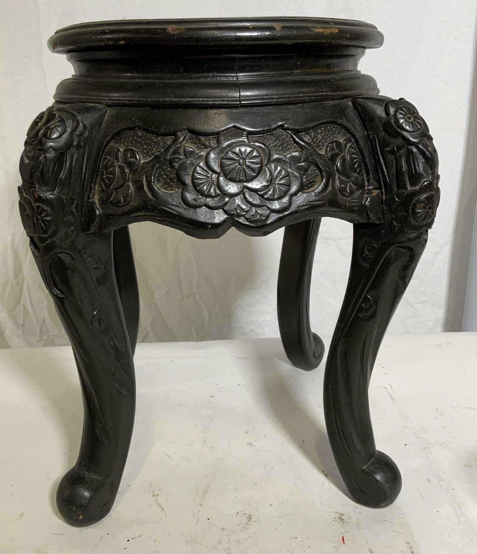 Hand Carved Wooden Asian Plant Stand: Possibly Japanese (three clawed dragon), possibly Meiji Period export furniture, possibly circa 1880 - 1920. Hand carved wooden Asian plant stand, scene to top displays a dragon, no apparent labels or