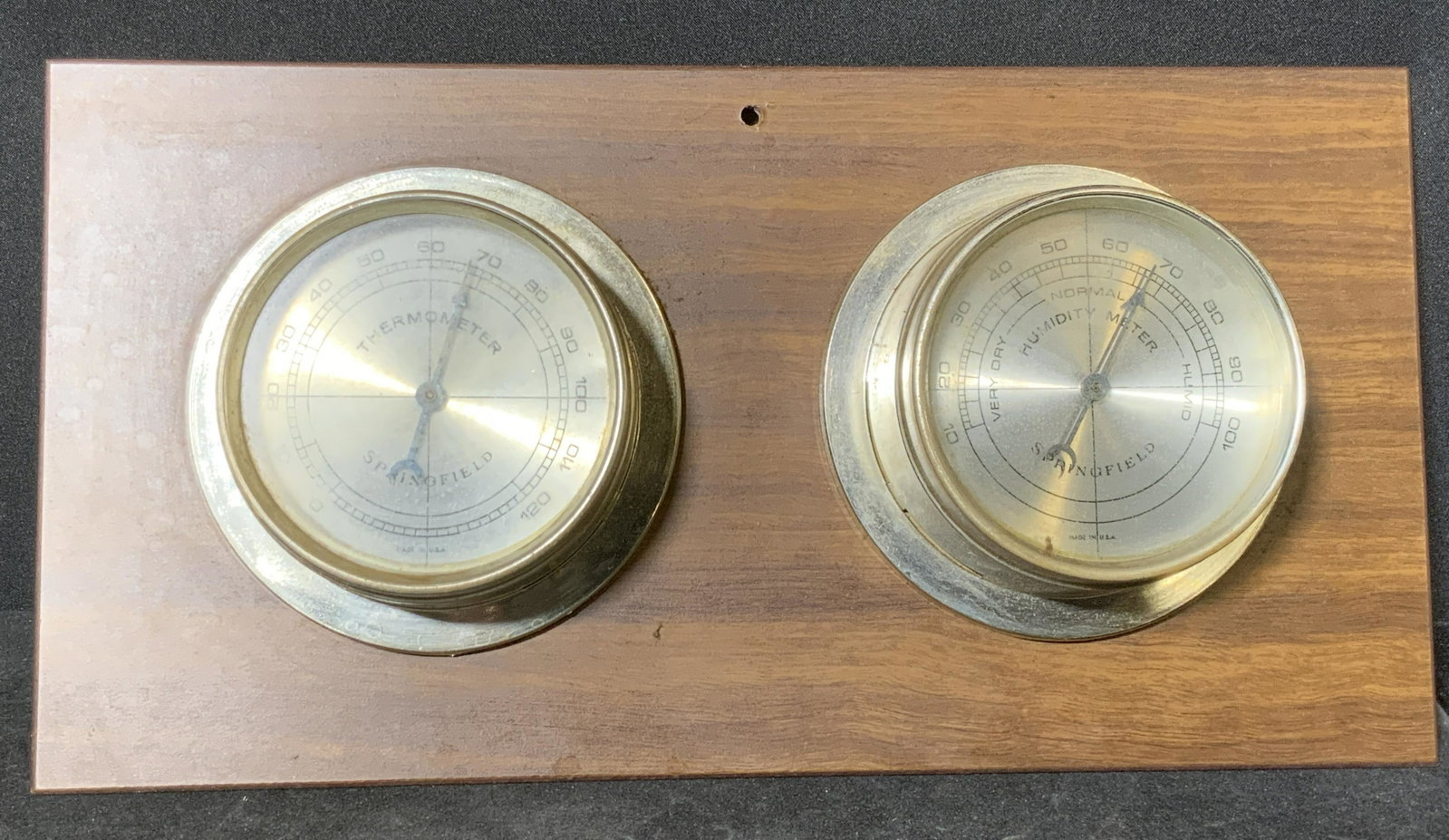 SPRINGFIELD INSTRUMENT CO. Mounted Thermometers: Vintage SPRINGFIELD INSTRUMENT COMPANY mounted thermometers. The thermometers are mounted to a piece of rich brown wood. Thermometers are crafted from metal, possibly brass. Underside possesses compan