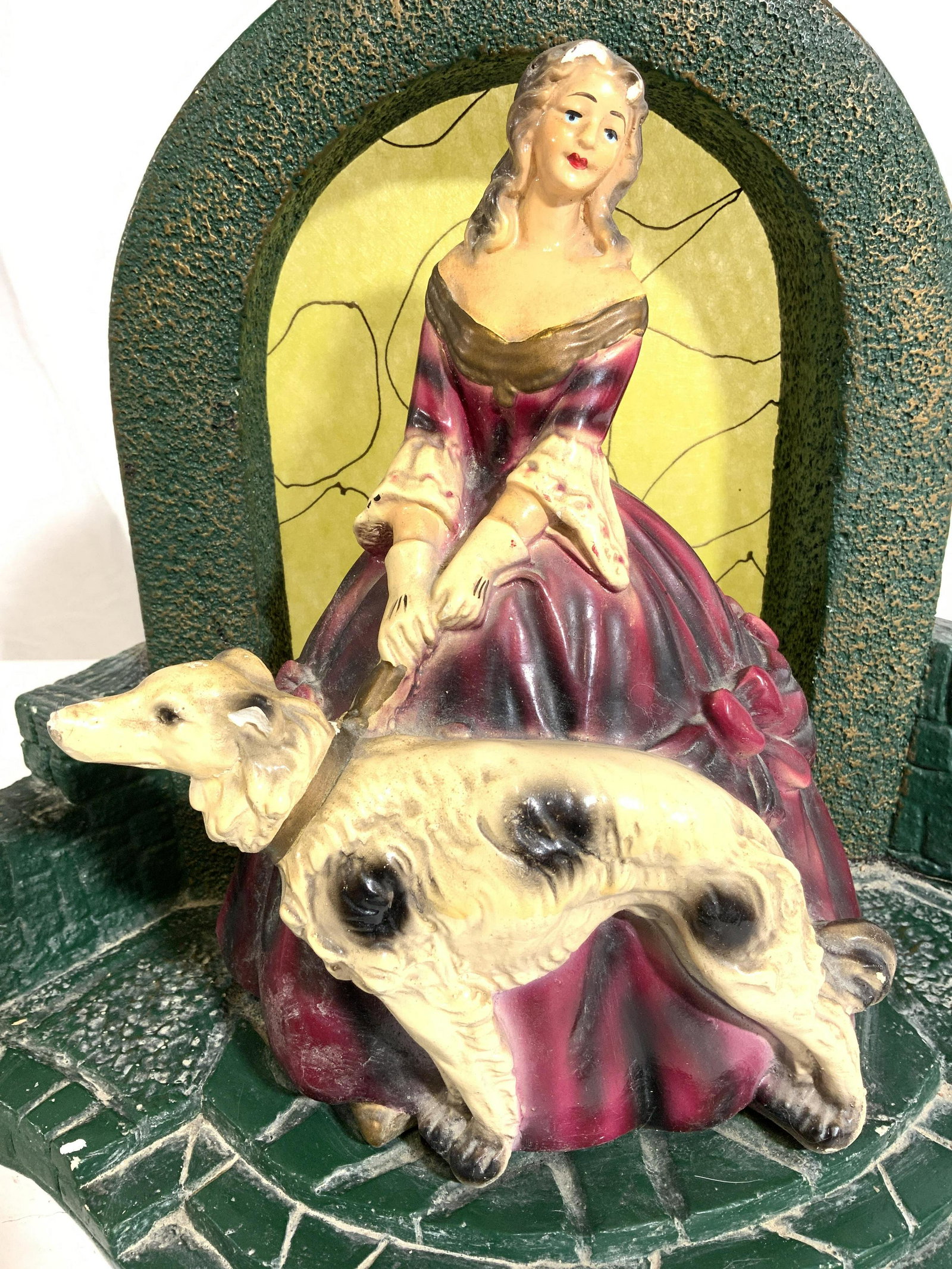Vintage Composite Lighting Fixture: Light fixture appears to be composite. Piece is possibly hand painted. Piece depicts a female figure wearing a dress with a dog on a leash. Bulb socket is on backside. Piece measures approx 11.5 inche