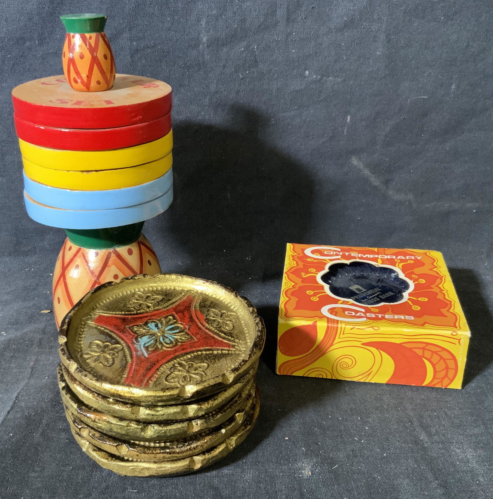 Group Lot 3 Coaster Sets: Group lot 3 coaster sets, label to wooden set reads ‘Made in Japan’, label to composite set reads ‘Contemporary Coasters’ ‘Ritepoint Made in U.S.A’, third set also made of wood and hand pa