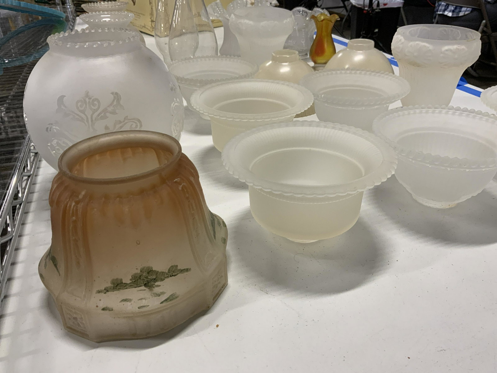 Lot 20 Vintage Glass Lamp Shades: Lot 20 Vintage Glass Lamp Shades, no apparent inscriptions or marks, smallest measures 3 7/8 x 2 1/4 inches at widest point, largest measures 6 1/8 inches x 6 inches at widest point, cracks and surfac