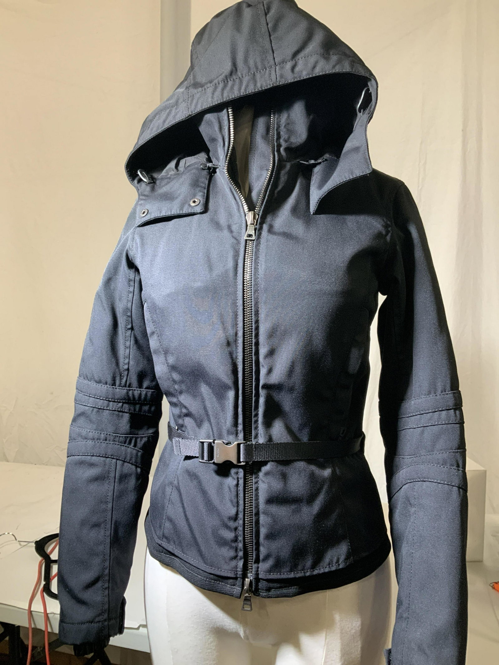 PRADA Winter Nylon Puffer Jacket Art 280588, Italy: Black Prada Jack art , size small, size 4, possibly 6, Nylon and cotton combo, zippered hand pockets with Prada lock key hook in one pocket, polyfill puffer lining , cute snap waist belt with Prada on