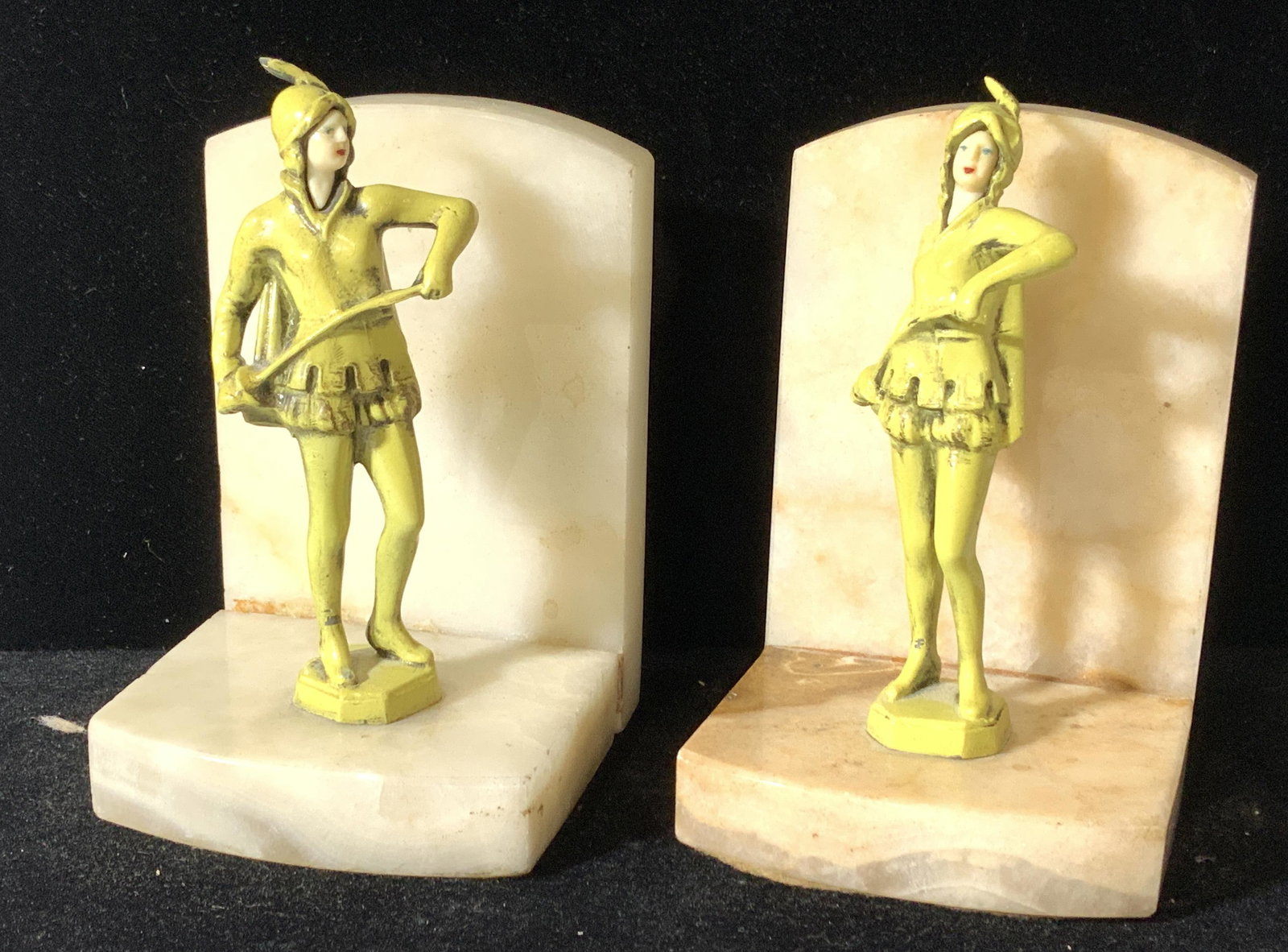 Pr Medieval Guardsman Figural Stone Bookends, Vntg: Enamel Female Figural Guards dressed in medieval attire, standing on natural polished stone bookends, possibly agate or marble. Very heavy pieces, vintage decor. Ht 5 in. Width app 3.5 in. Bookends, S