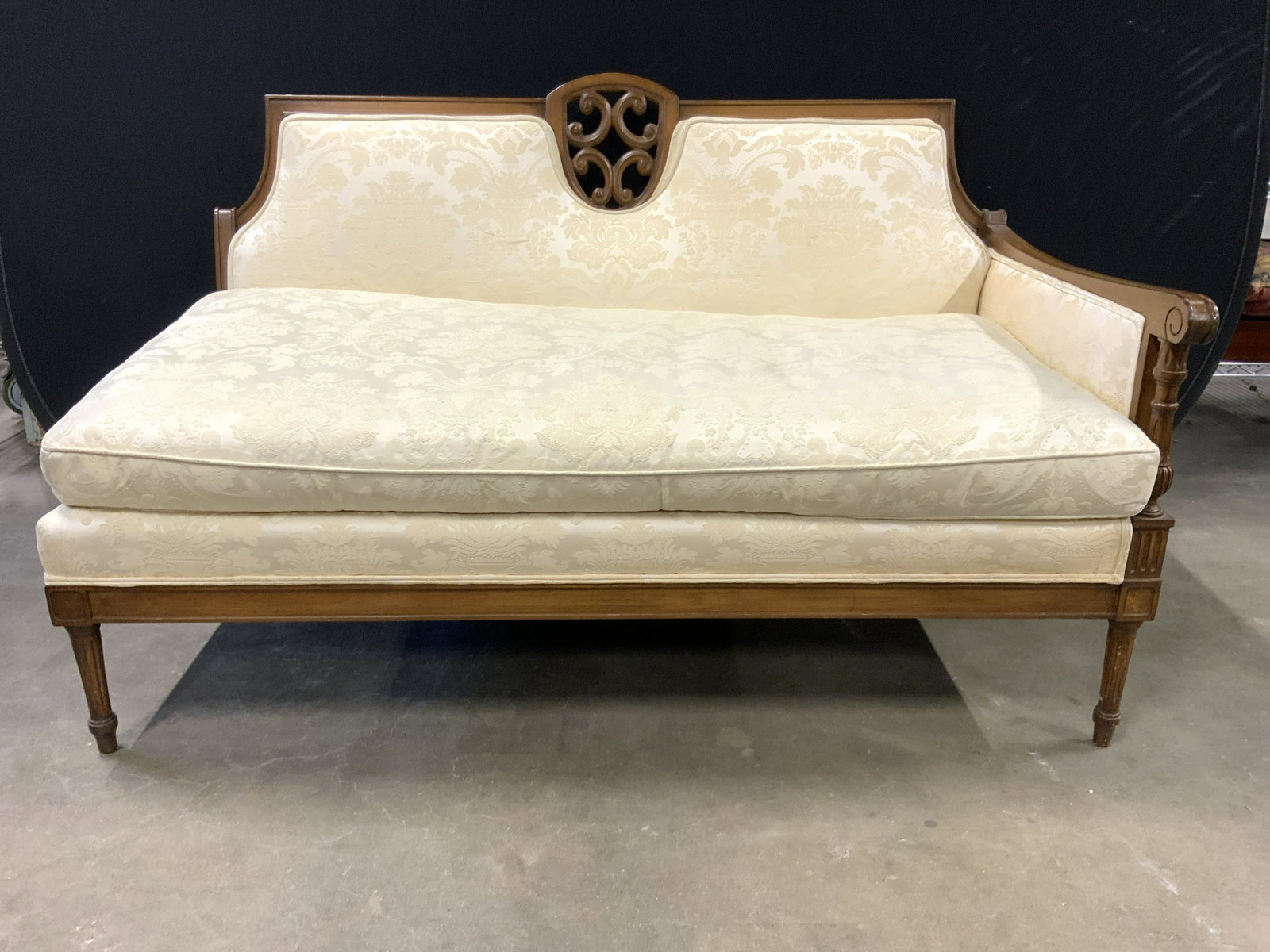 HABER UPHOLSTERY SHOP CORP Upholstered Sofa: Wood frame with cream toned floral upholstery. Piece measures approx 53 inches long 32 inches tall 31 inches deep. Piece matches previous lot in auction. Evident wear and splitting to fabric. 6