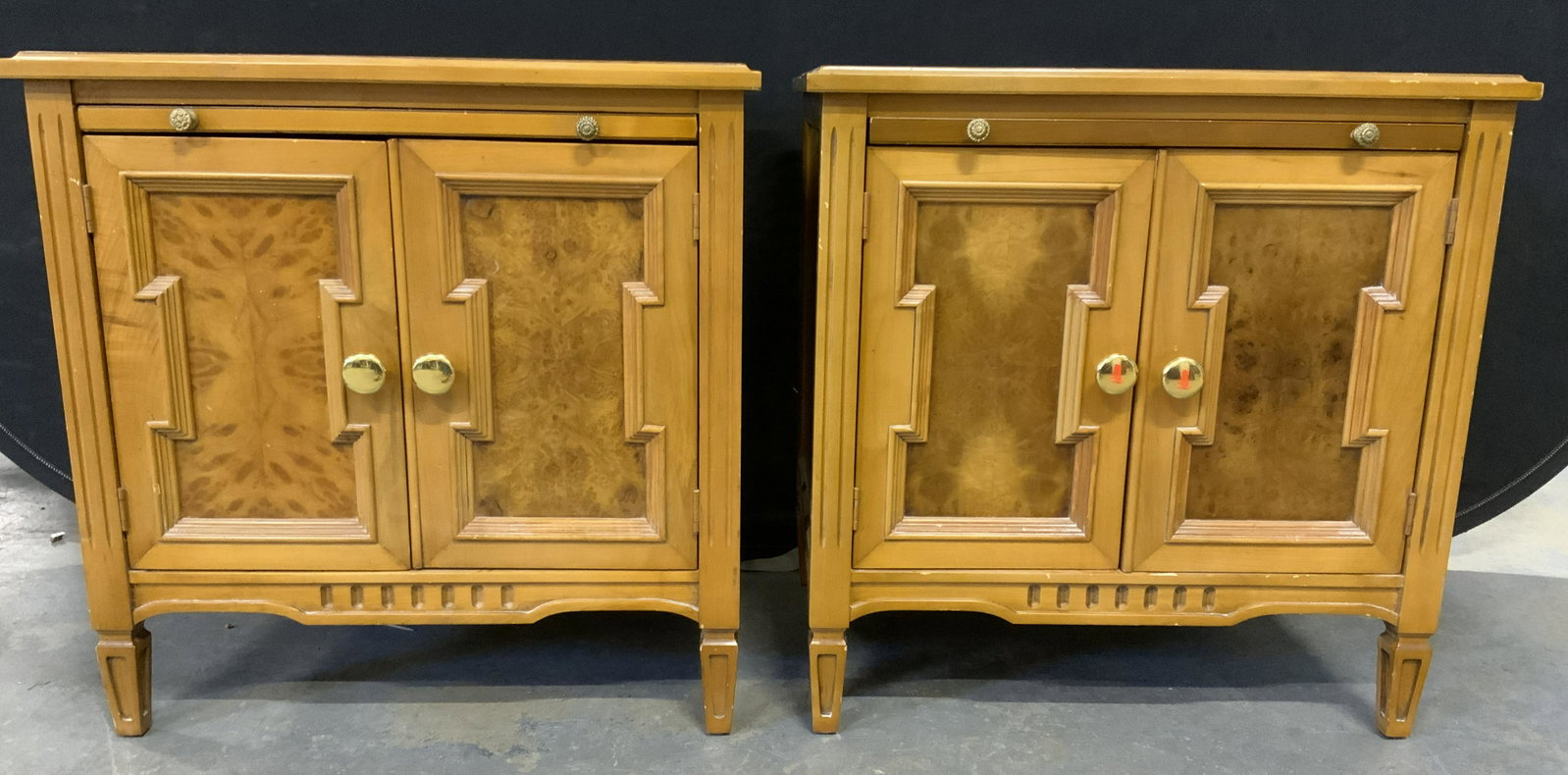 Pair Wooden Night Stands: Pair of wooden night stands, possibly vintage. Each houses a pull out tray, and a glass shelf. Hardware securing doors needs to be replaced. Each measures approx 24.5 inches h x 24 inches W x 17.5 inc