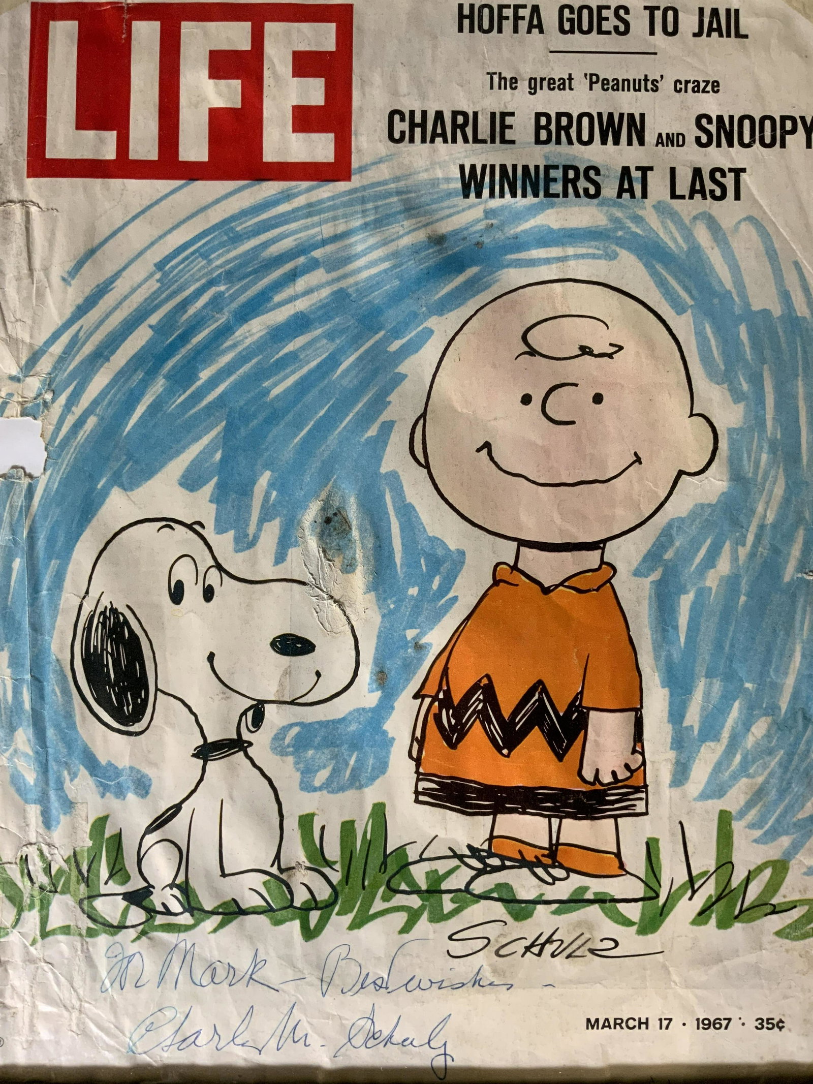 CHARLES SCHULZ Signed Life Magazine Cover: CHARLES SCHULZ Signed Life Magazine Cover, signature to lower left reads ‘Charles M Schulz’, other signature unclear, measures 16 7/8 x 15 inches, black wooden frame, surface wear to frame, profes