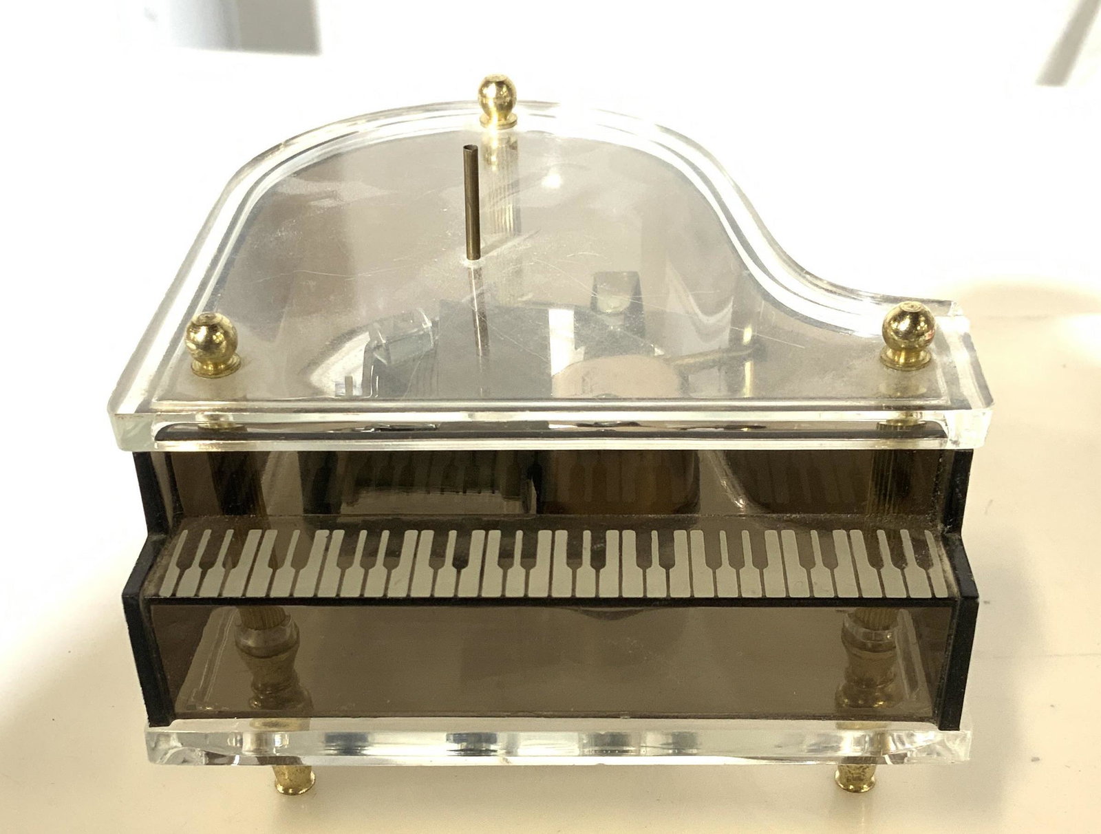 Grand Piano Dresser Top Music Box, Hong Kong: Translucent Composite Grand Piano form with piano keys and brass accents, plays soft ballerina music, uses Sankyo Japan Movement , part # J.P. 10337152. 2.5 in ht, 4 x 4 in. Music Box, Ballerina Music