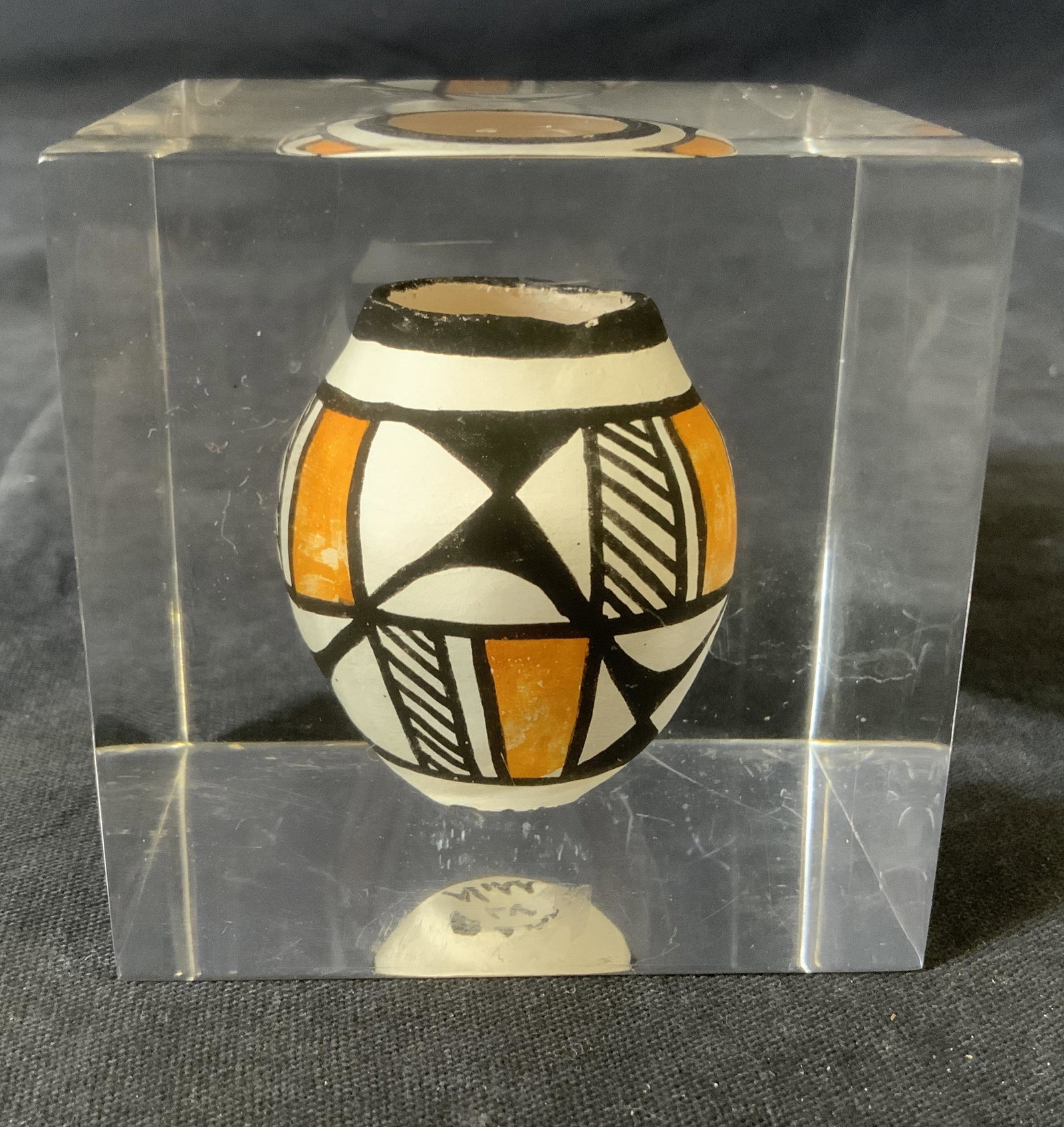 Acoma New Mexico Miniature Pot Paperweight: Acoma New Mexico Miniature Pot Paperweight, inscription to pot reads ‘Acoma LV NM’, measures 2 1/2 x 2 1/2 inches, some surface wear to piece, Native American pottery, indigenous art, miniature po