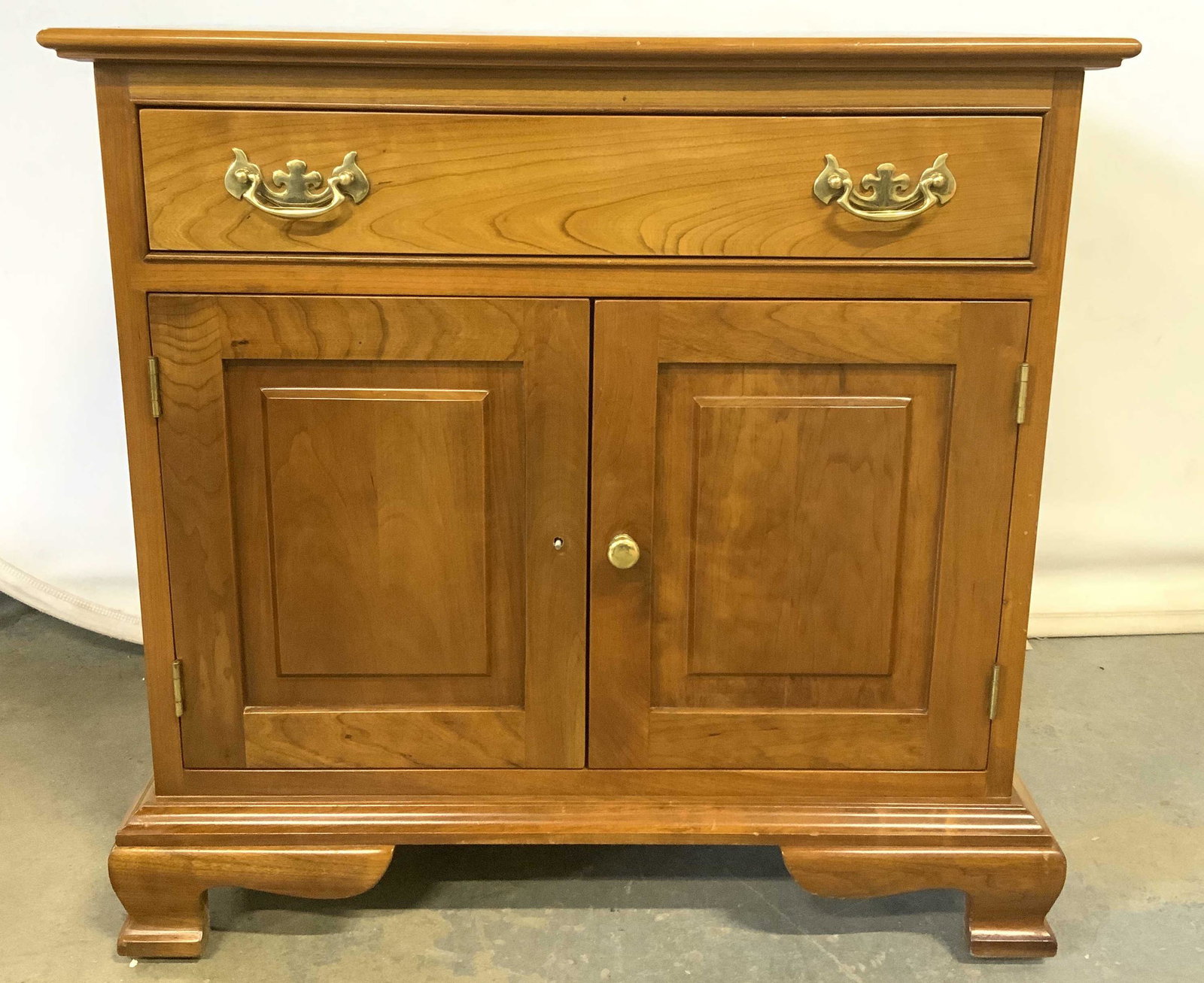 Vintage LEOPOLD STICKLEY Nightstand: Vintage wooden nightstand, possibly cherry. Drawer is marked STICKLEY FAYETTEVILLE, label reads as A LEOPOLD STICKLEY ORIGINAL, care instructions also present. One drawer and a cabinet. Measures appro
