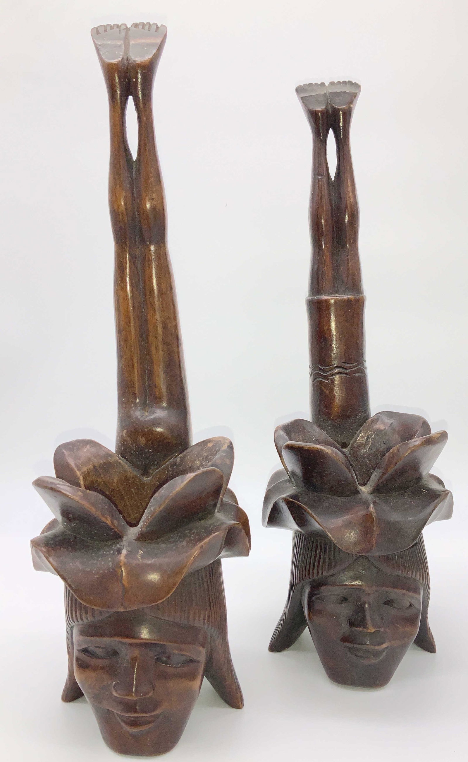 Pair Collectible Tribal Carved Wood Accessories: Hand carved vessels featuring prominent face with leaf headpiece. Backside reveals full human form upside down , display underside of feet. Hanging hooks on backside, or stand on side table or shelf. 