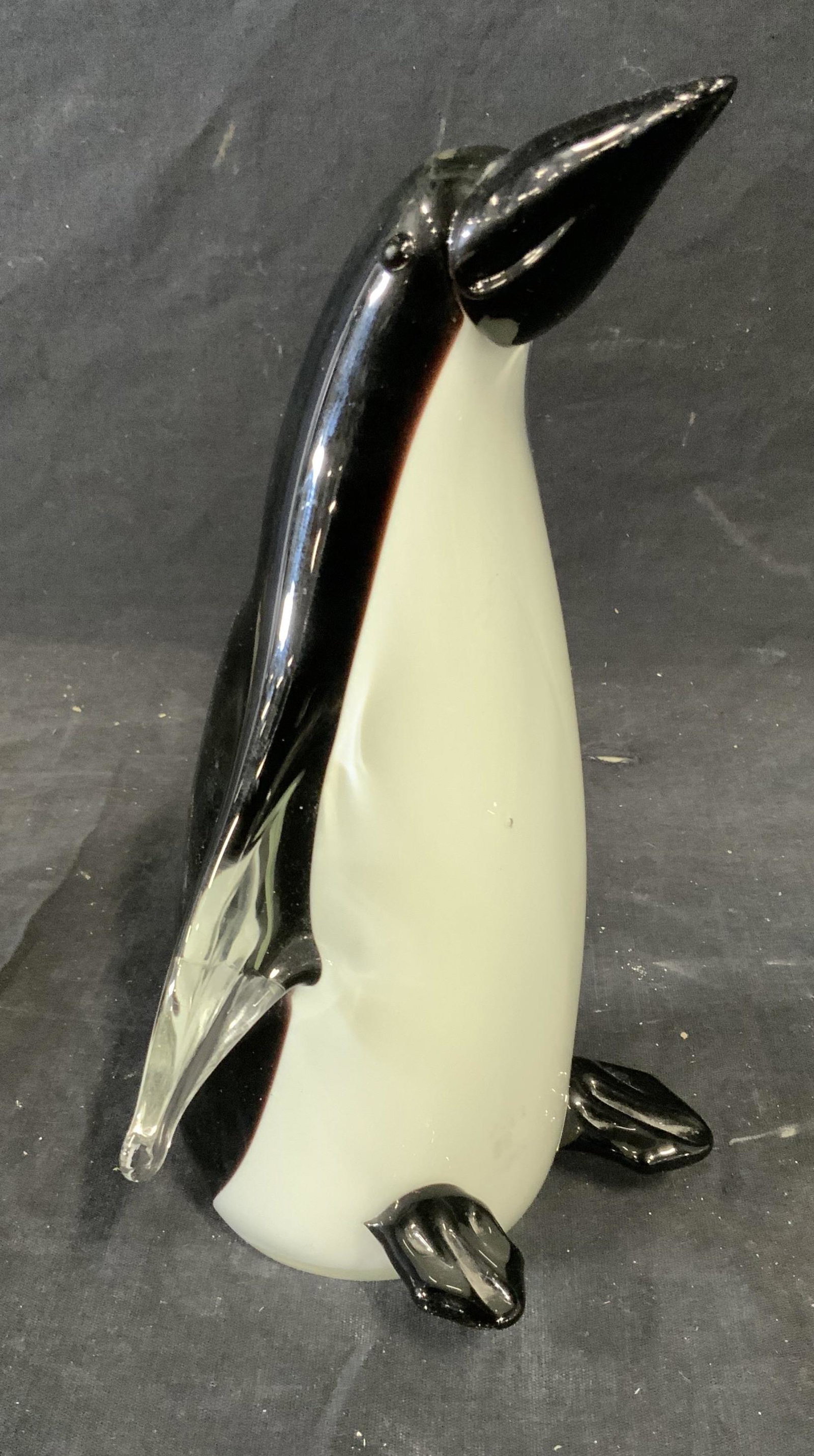 Art Glass Penguin Sculpture: Art glass penguin sculpture, label to underside reads ‘Dynasty Gallery Since 1951 China’, figure double walled glass with colored glass to the interior with clear to the exterior, piece measures 8
