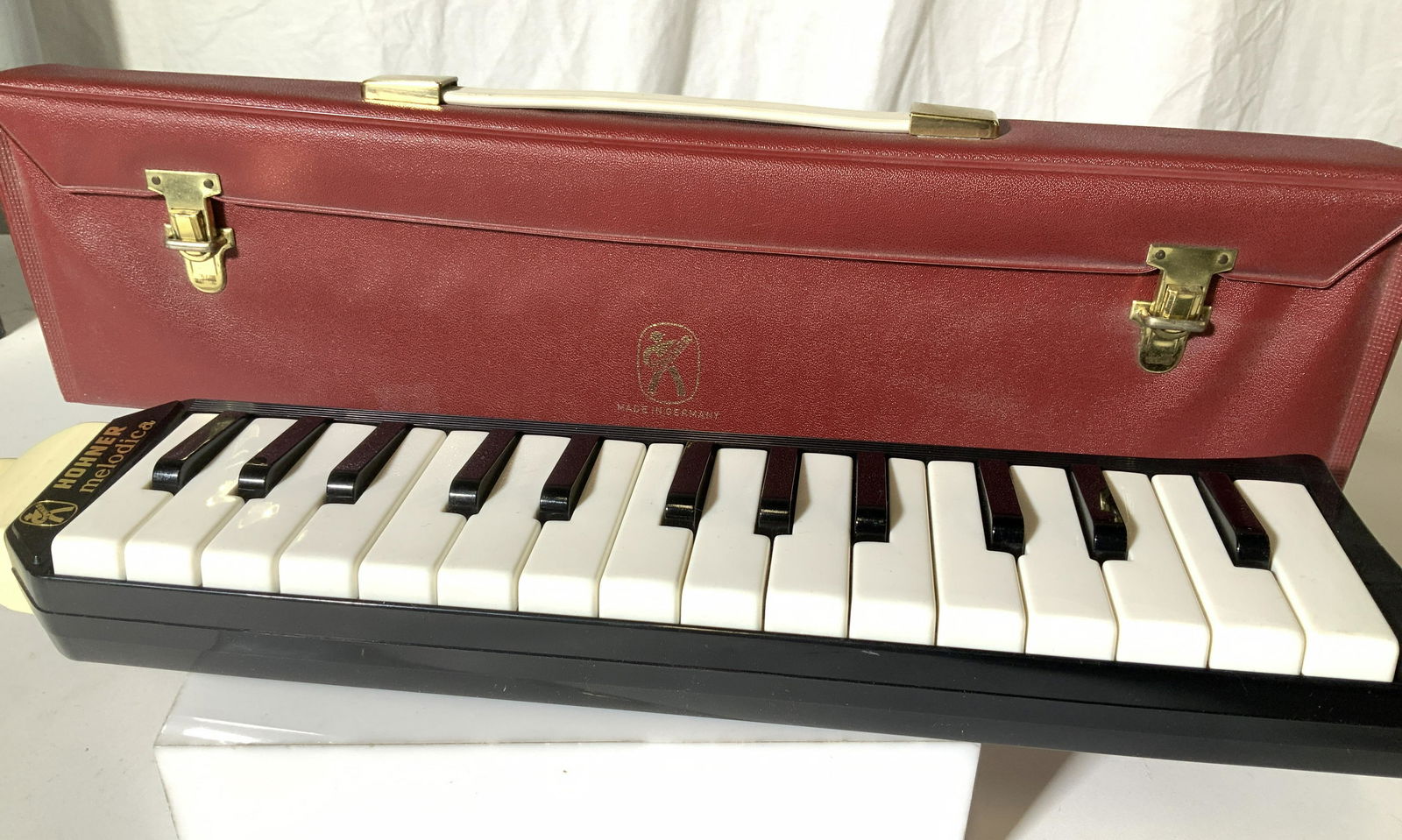 Collectible HOHNER MELODICA in Case, Germany: Vintage HOHNER MELODICA Piano 27, Made In Germany, includes original Carry Case with snap buckles and holding strap on instrument. Instrument labeled. Mouth piece attached. Not tested for working cond