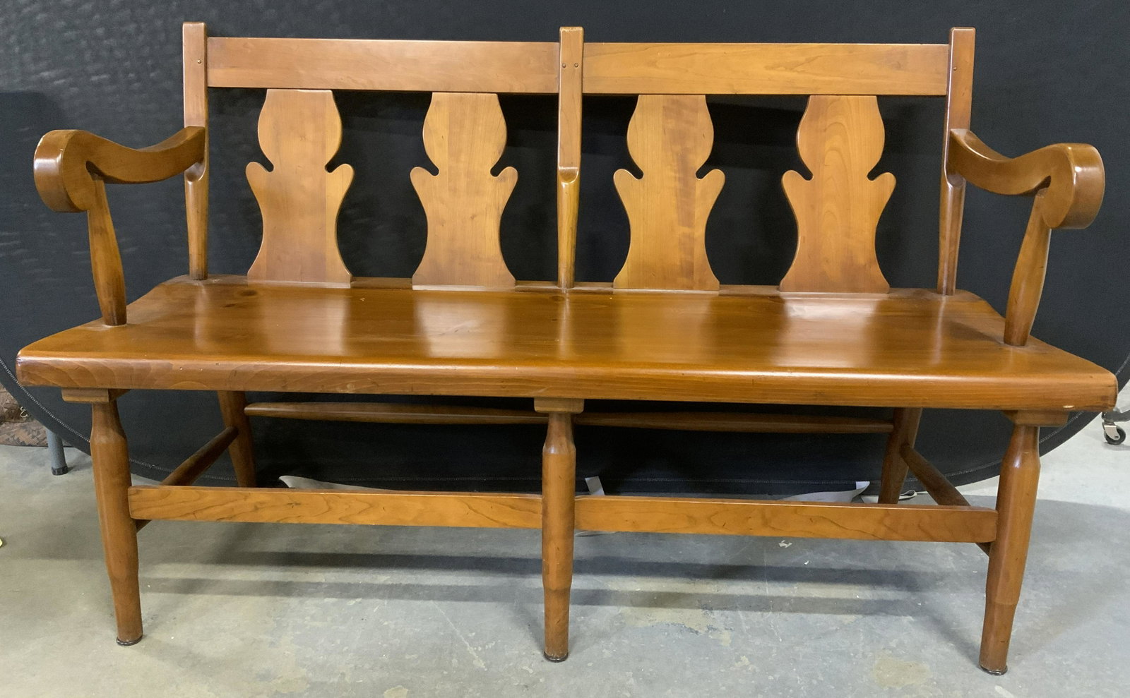 STICKLEY Wooden Fiddleback Bench: Wooden fiddleback bench, possibly vintage. Underside is reads as STICKLEY FAYETTEVILLE. Legs are joined by stretchers. Measures approx 33 inches H, 52.25 inches W, 19.25 inches deep. Wooden bench, pub