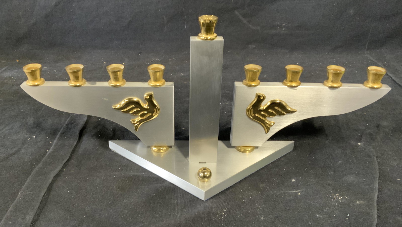 Gold and Silver Plated Menorah: Gold and silver plated menorah, label to underside reads ‘Oppenheimer 24k gold & silver plated Jerusalem Registered Design’, menorah is designed in a modern abstract style with two doves decoratin