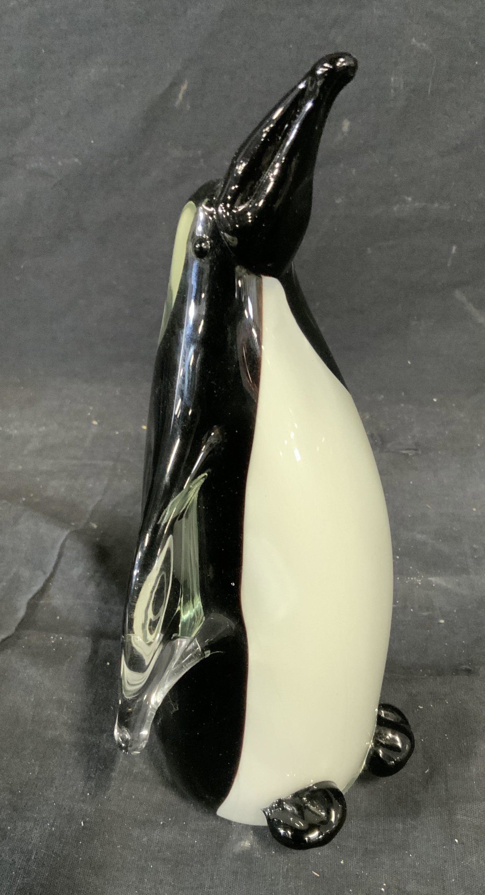 Art Glass Penguin Sculpture: Art glass penguin sculpture, label to underside reads ‘Dynasty Gallery Since 1951 China’, figure double walled glass with colored glass to the interior with clear to the exterior, piece measures 8