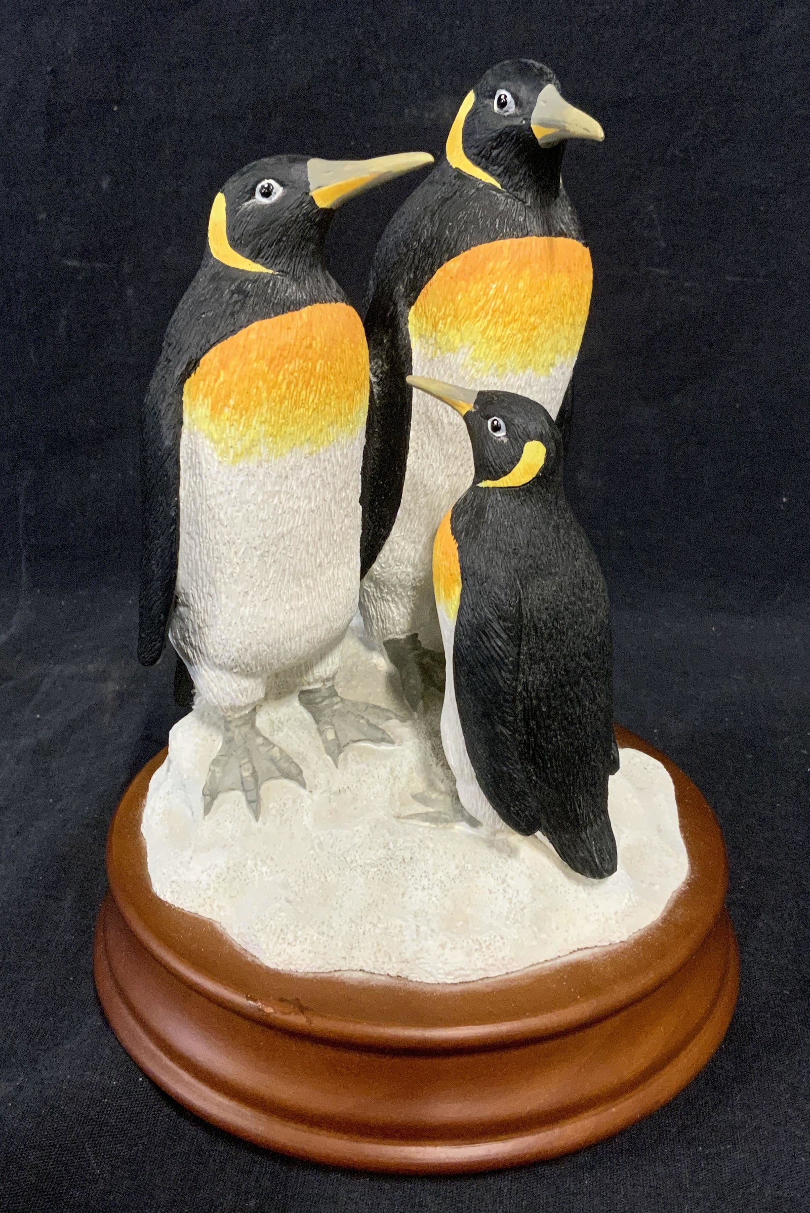 Decorate Penguin Trio Accessory: Decorative accessory, resembles a family of penguins standing on a snow mound. Base is wooden. Penguins are hand painted. Measures approx 7.5 inches H, and 5.75 inches W. Wear is consistent with age a