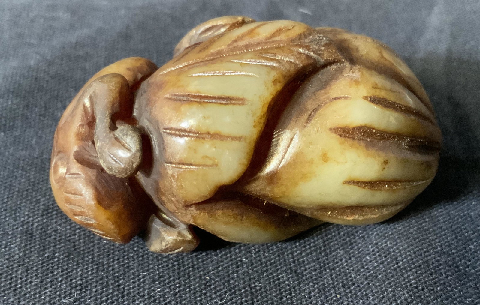Jadeite Frog Figurine: Jadeite Frog Figurine, no apparent inscriptions or marks, subject a frog perched on a leaf and stone, measures 2 inches long x 1 inch at widest point, Jadeite, frog, figurine, Figural, tabletop access