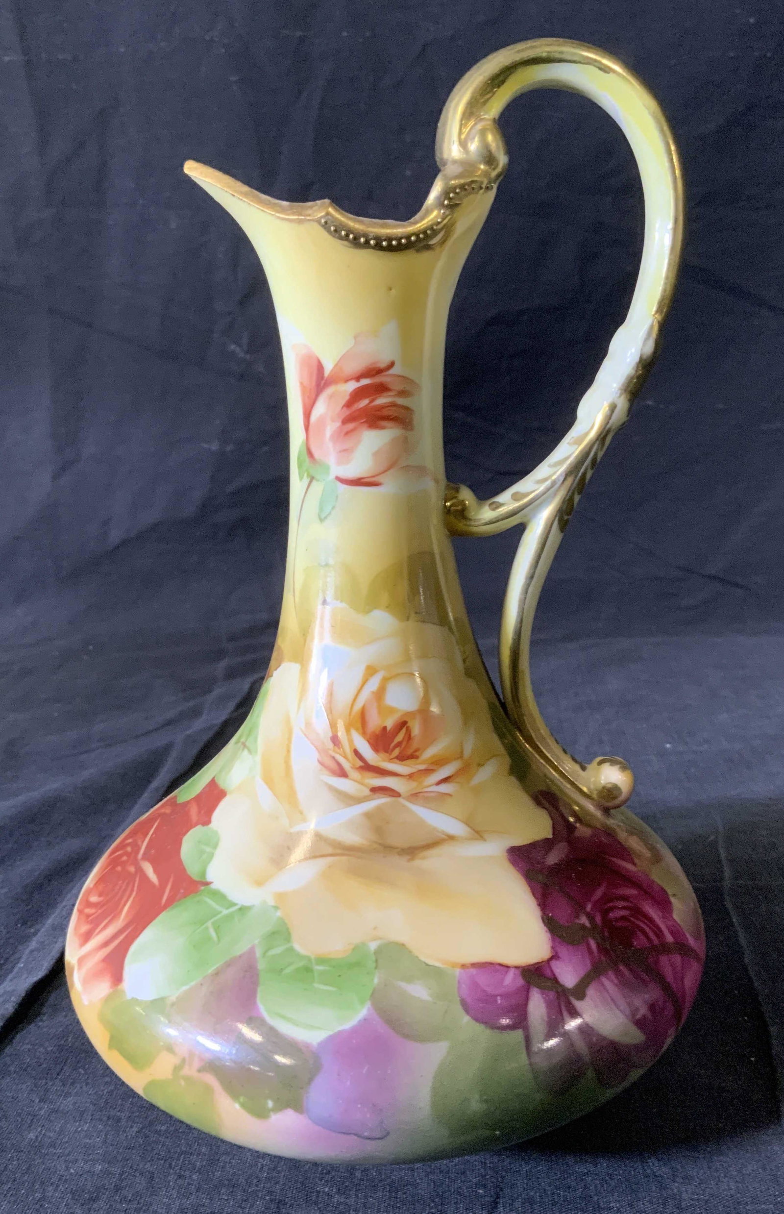 Vintage Hand Painted Japanese Pitcher: Vintage Hand Painted Japanese Pitcher, possibly antique, stamp to base read ‘Nippon Hand painted’, measures 9 inches tall x 6 inches in diameter at widest point, surface wear consistent with vinta