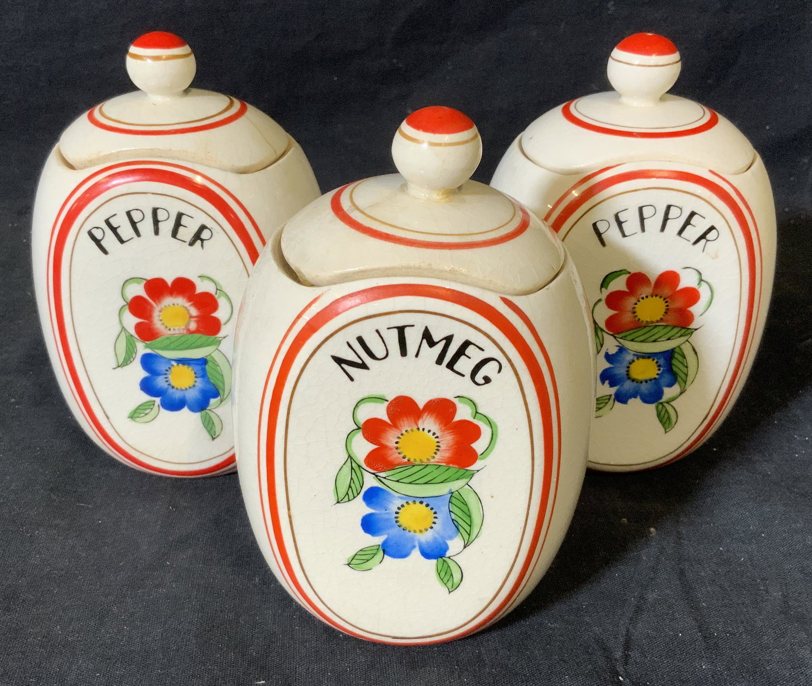 3 Japanese Labeled Ceramic Containers: 3 Japanese labeled ceramic containers, underside of each reads ‘Japan’, all three are lidded jars, labels to jars read ‘Pepper’ ‘Nutmeg’ and ‘Pepper’, each are identical in shape and f