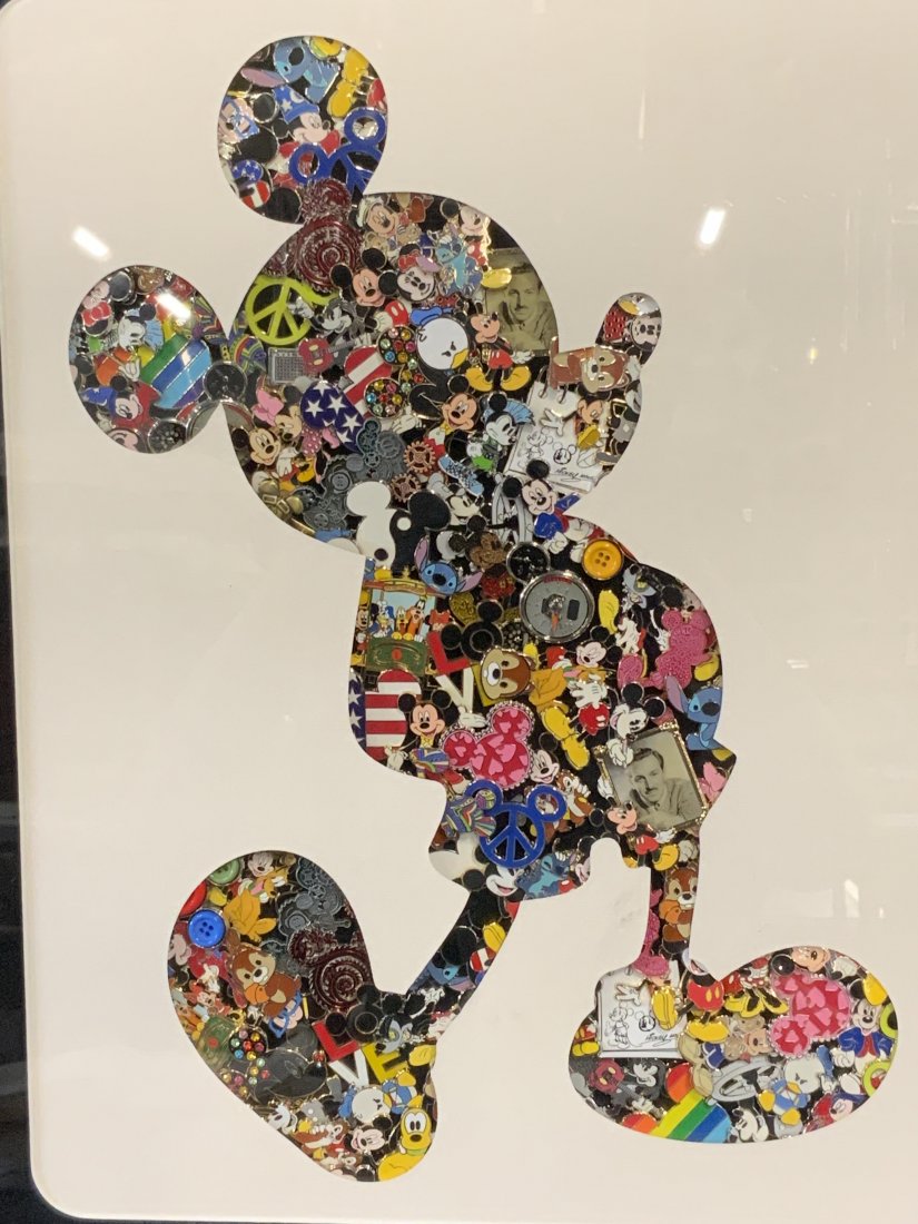 Commemorative Disney Enamel Pin Collage: Densely Enamel Pin Collage, no apparent inscriptions or markings, subject a silhouette of Mickey Mouse with a variety of Disney Enamel pins filling in the form, black and white matting, black composit