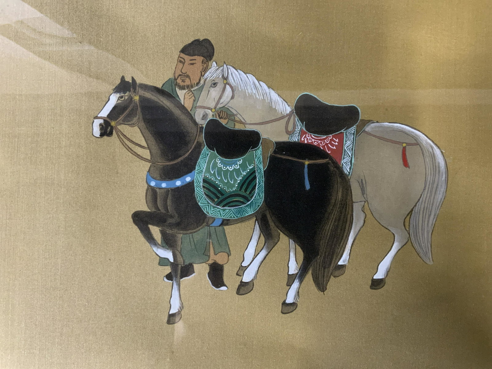 Chinese Painting on Silk, Artwork: Chinese Painting on Silk, inscription to lower right in Chinese characters, subject a man leading two horses, measures 18 x 21 7/8 inches, wooden frame, surface wear to frame, professionally framed an