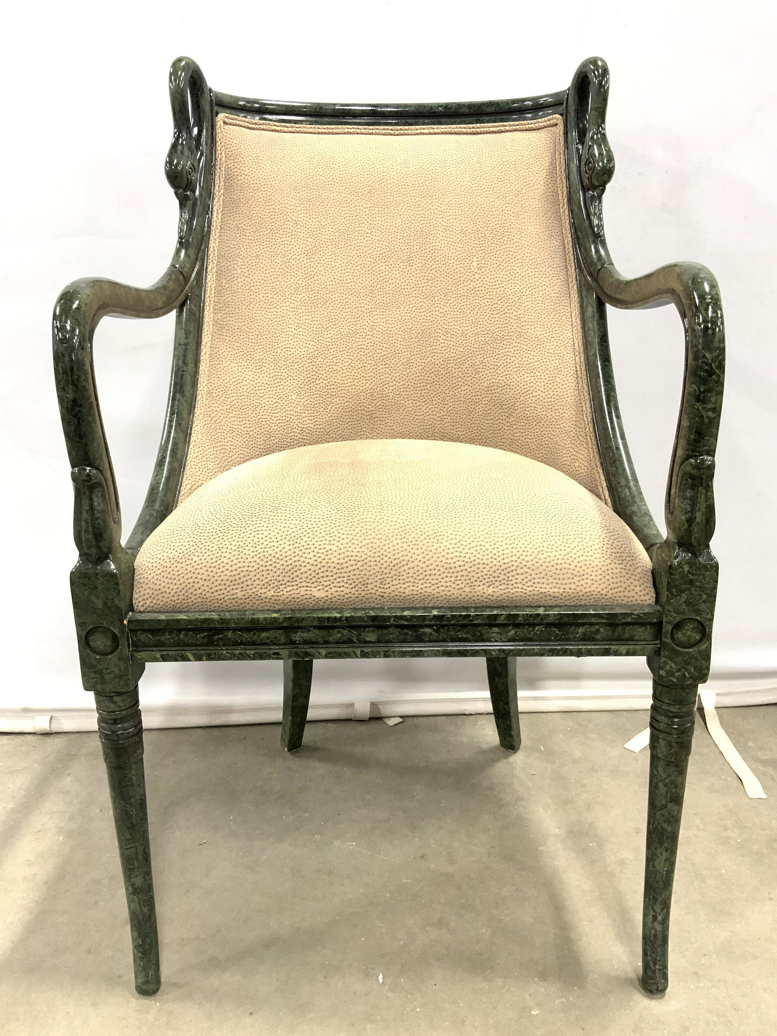 Swan Back Retro Palm Beach Style End Chair: Chair has forest green toned frame. Painted in green malachite design. Piece has sand toned upholstery with dotted detail. Edge of upholstery has double welting. Top of sides of backrests have swan he