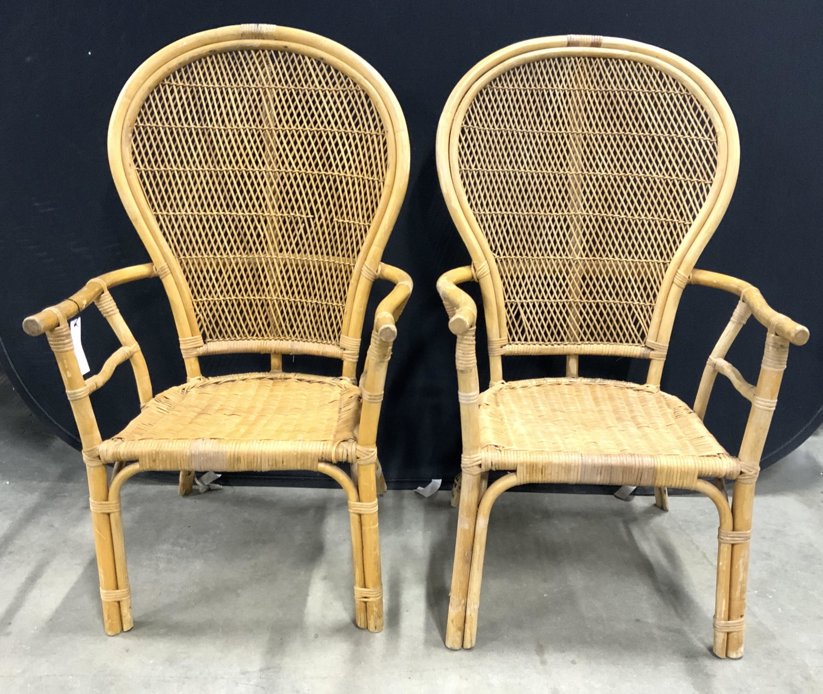 Pair Woven Wicker Fan Back Chairs: Lot includes 2 chairs. Fan back style. Each appear to be woven wicker & possibly bamboo. Chairs have fan back with balloon back shape. Chair Frames appear to be bamboo. Piece measures approx 44 inches