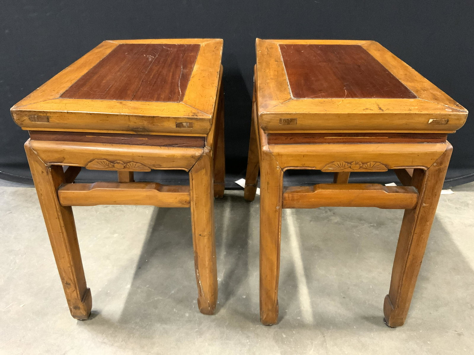 Vintage Carved Wooden Asian Side Tables: Side tables are vintage possibly antique. Each piece is wooden. Tables appear to possibly be hand crafted. Each foot is chow style. Pieces measure approx 20 inches tall 21 inches long 13 inches deep.