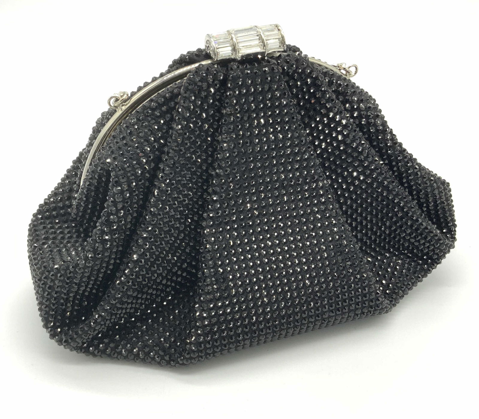 JUDITH LEIBER Enchanted Black Crystal Clutch W Box: A collectible Enchanted Judith Leiber clutch. The piece is comprised of crystal encrusted soft satin that stands out with artful pleating, a deco-inspired closure and a sparkling baguette crystal chai
