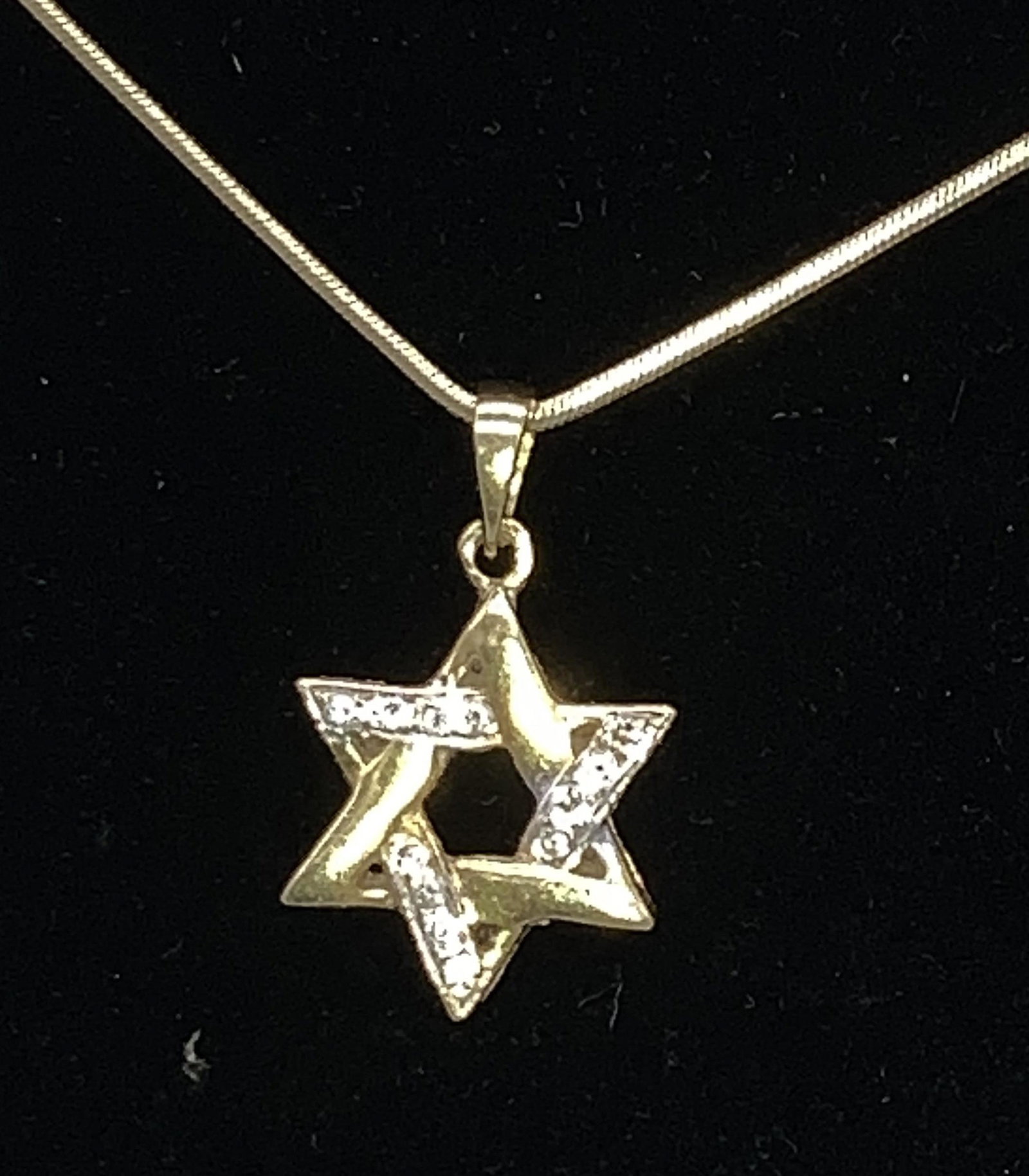 14 K & Diamond Star of David Pendant Chain: 16 in. 14 k Snake chain, Hallmarked 585 on clasp. Pendant bake marked B 7 H . Total of 16 diamonds. Pendant measures .5 in diameter. Gold chain only 2.1 dwt. Pendant possibly gold plated. Yellow Gold 