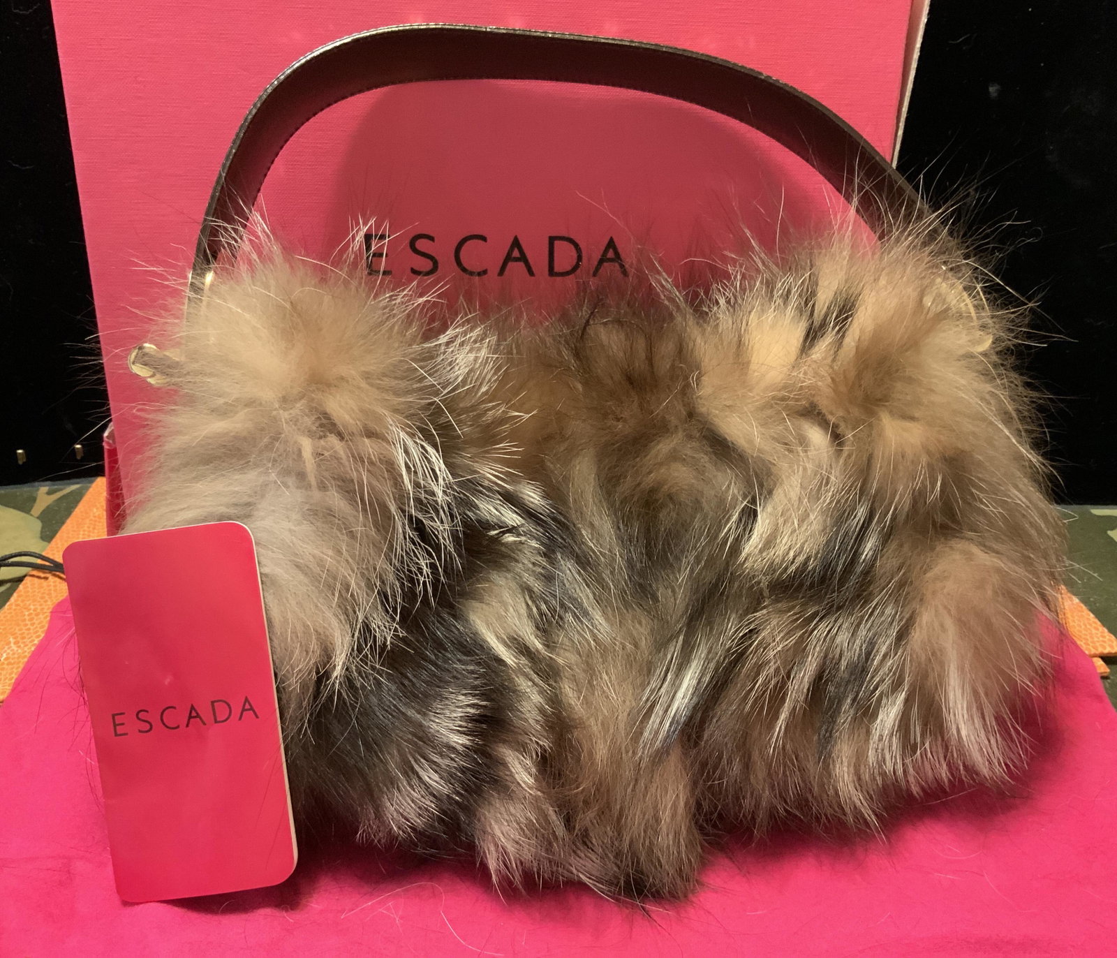 ESCADA Leather Racoon Fur Purse w Box, Italy: Never used, Long haired fur purse wide leather strap with quality hardware detailing. Inside lined with pink silk, purse has never been worn and comes with original ESCADA pink dust bag and escada box