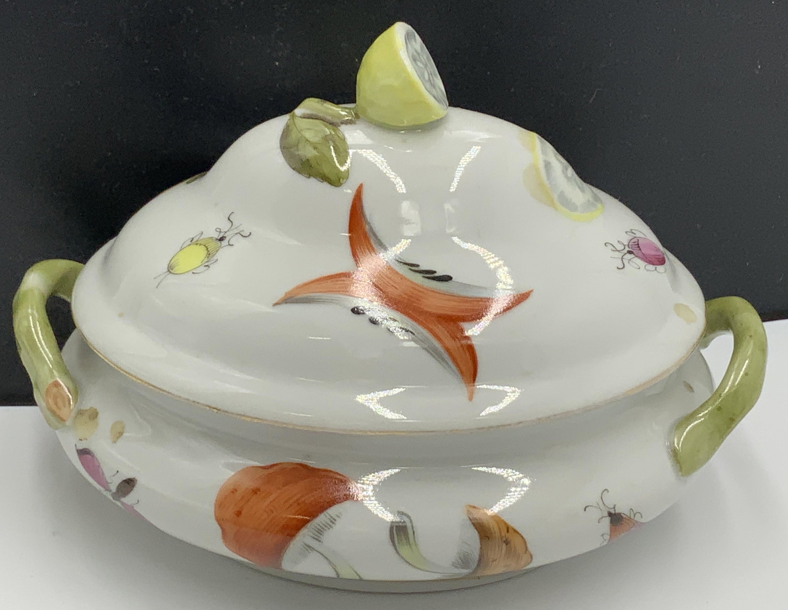 Herend Mushroom & Insect Sugar bowl ,Lemon Lid: Hand Painted Porcelain Herend Sugar Bowl With Lemon Figural lid. In style of miniature tureen. Hand painted with mushrooms, fruit, insects, and Hallmarked Herend , no 6019, 15. 5 x 4 x 3.5 in. The Imp
