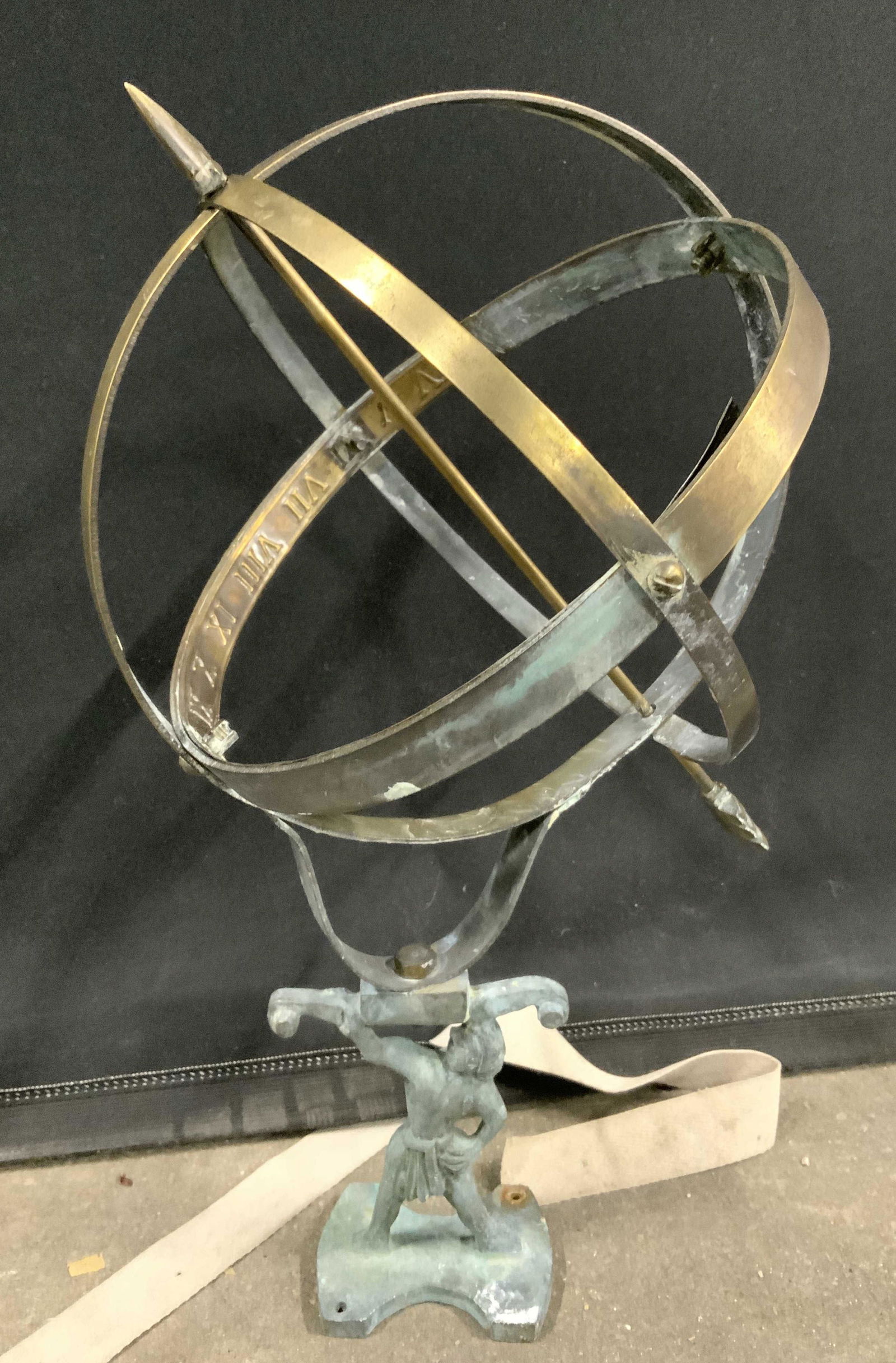 Vintage Copper & Brass Armillary: Armillary is vintage. Piece appears to be copper & brass. Piece has Roman numerals on inside of structure. Piece measures approx 14 inches tall 8.5 inches wide. Base of piece has muscular male figural