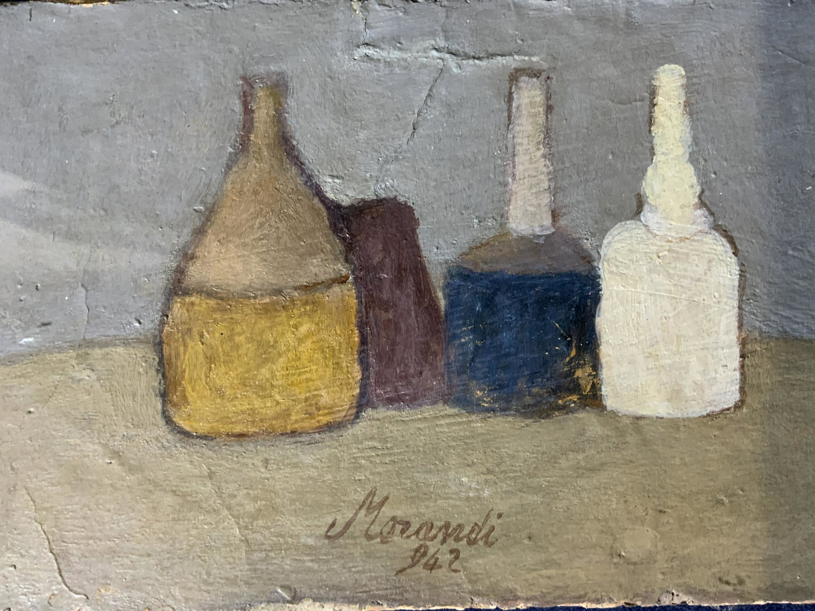 Signed Oil Painting AFTER GIORGIO MORANDI: Signed Oil Painting AFTER GIORGIO MORANDI, signature to piece reads ‘MORANDI 942’, label to reverse reads ‘Giorgio MORANDI 1890-1964 Still Life Circa 1942, 1942 4 1/4 x 6 5/8’, Please Note: Al