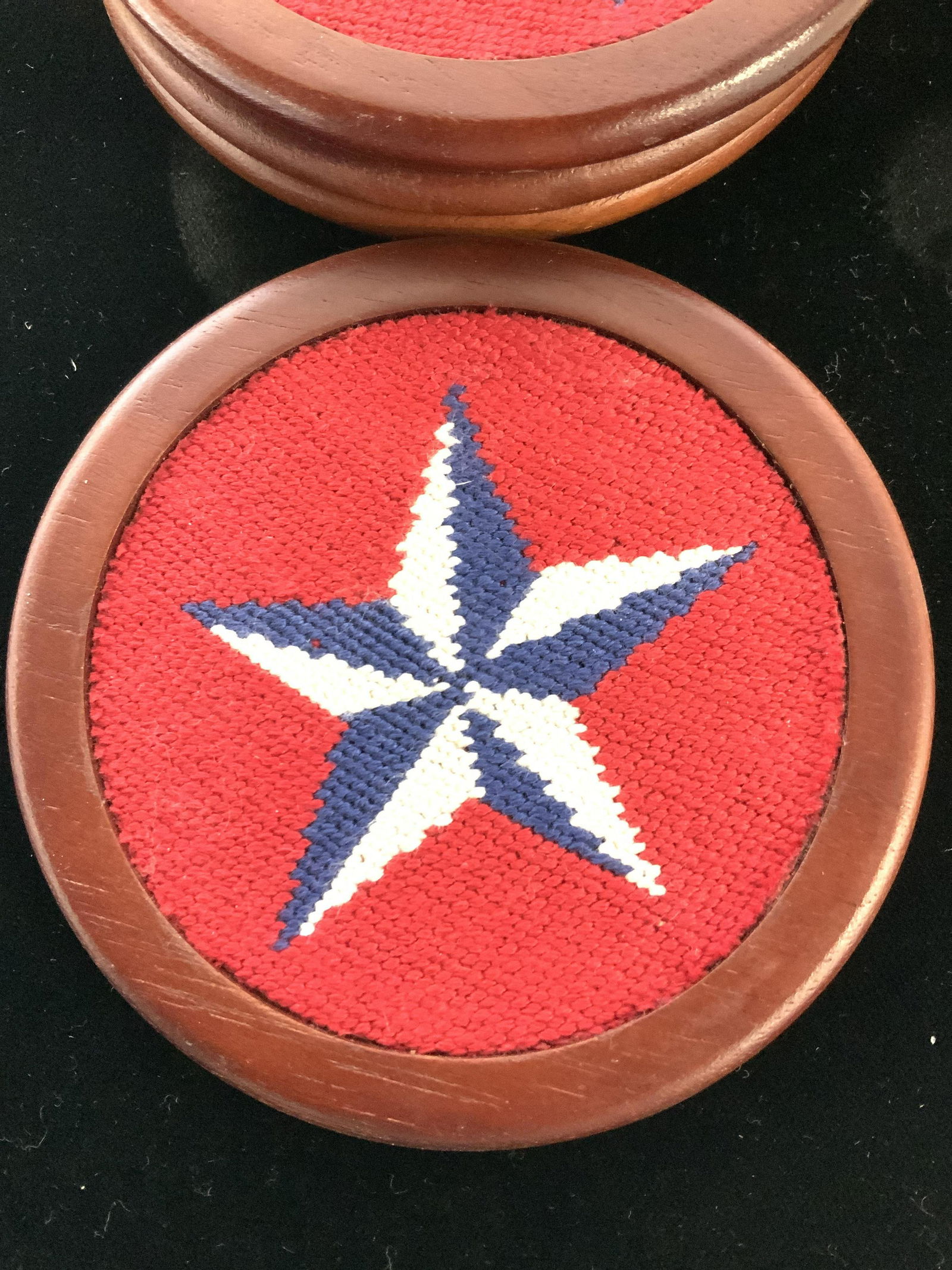 Petite Point Wood Coasters, Smathers & Branson: Blue and white Star with red background, all hand sewed petite point, set 4 coaters , 4 in. With Wood holder. Total 5 pcs. No major surface issues to Wood. Cherry wood stain. Holder app 1.5 in ht. 5 x