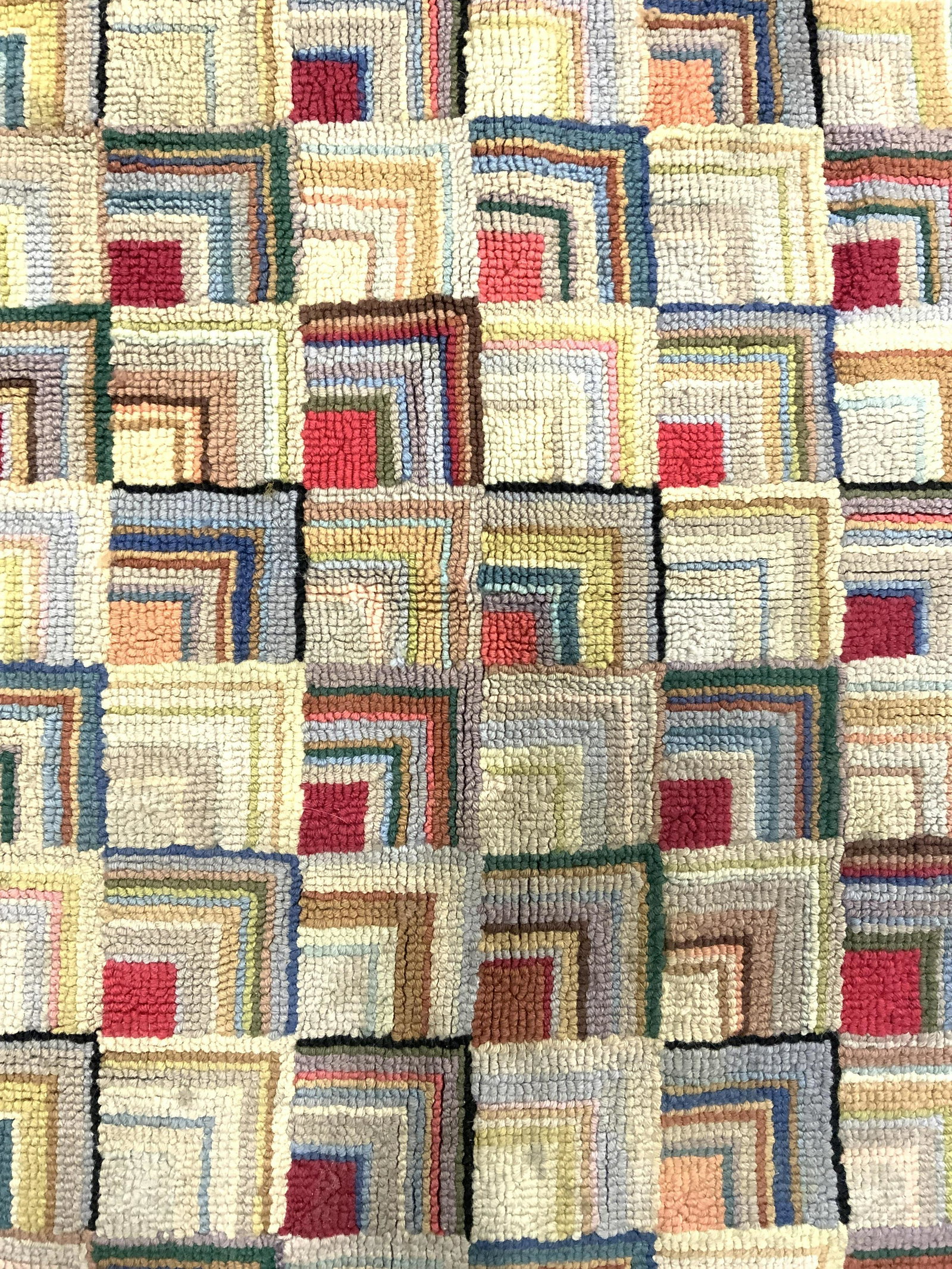 CLAIRES AMERICAN CLASSICS Hand Hooked Rug: Tag on underside reads CLAIRES AMERICAN CLASSICS, WOOL HAND HOOKED. Rug has multi toned geometric detail with black toned outer area. Piece measures approx 36 inches long 25 inches wide. Rug, carpet, 