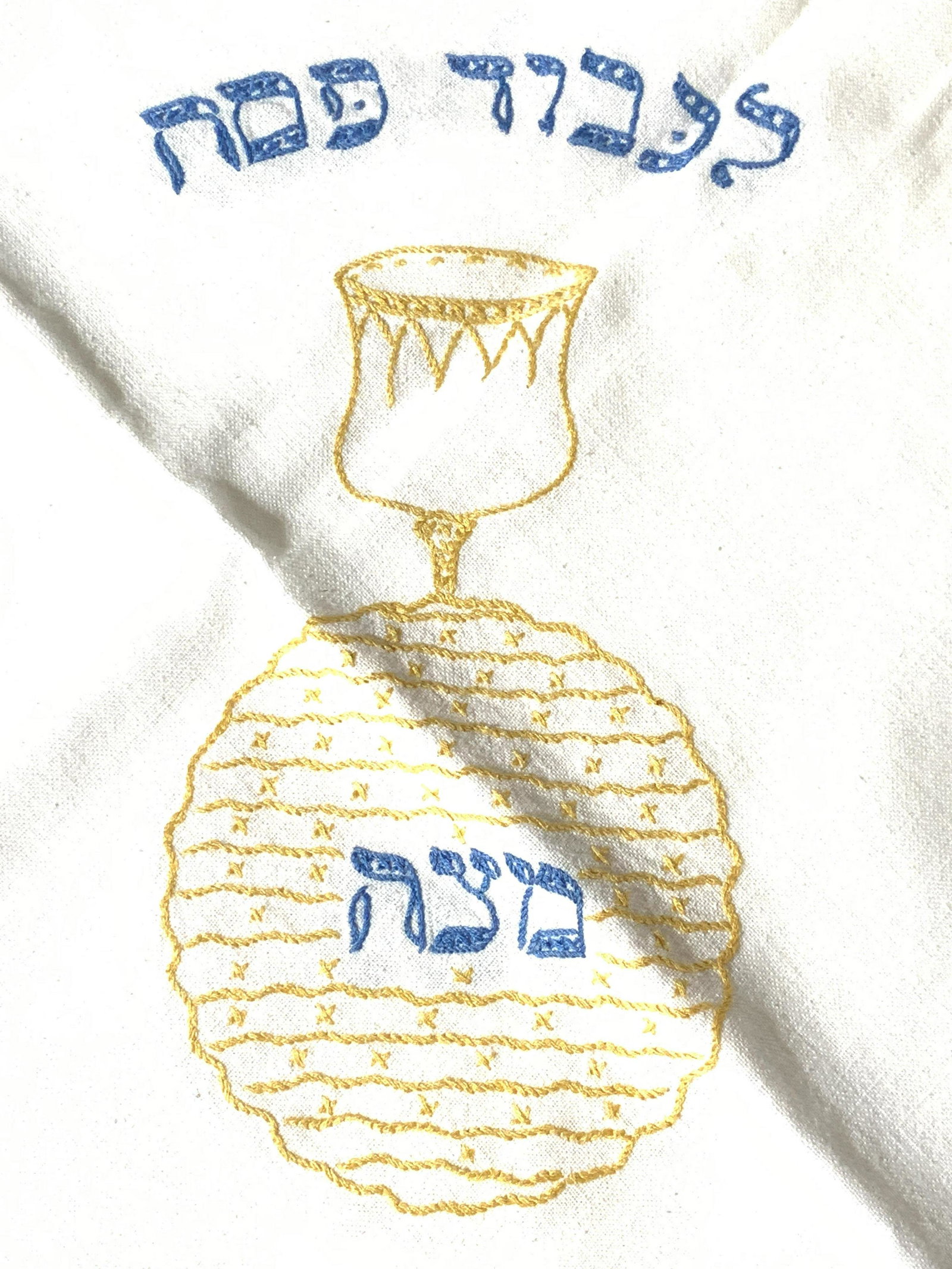 Embroidered Linen Passover Tablecloth, Collect.: Cream colored Linen Tablecloth, cross-stitch embroidery by hand, 54 x 95 in., with all the elements for Passover. blue and yellow embroidery. Light blemishing, Collectible table clothes, Passover Tabl